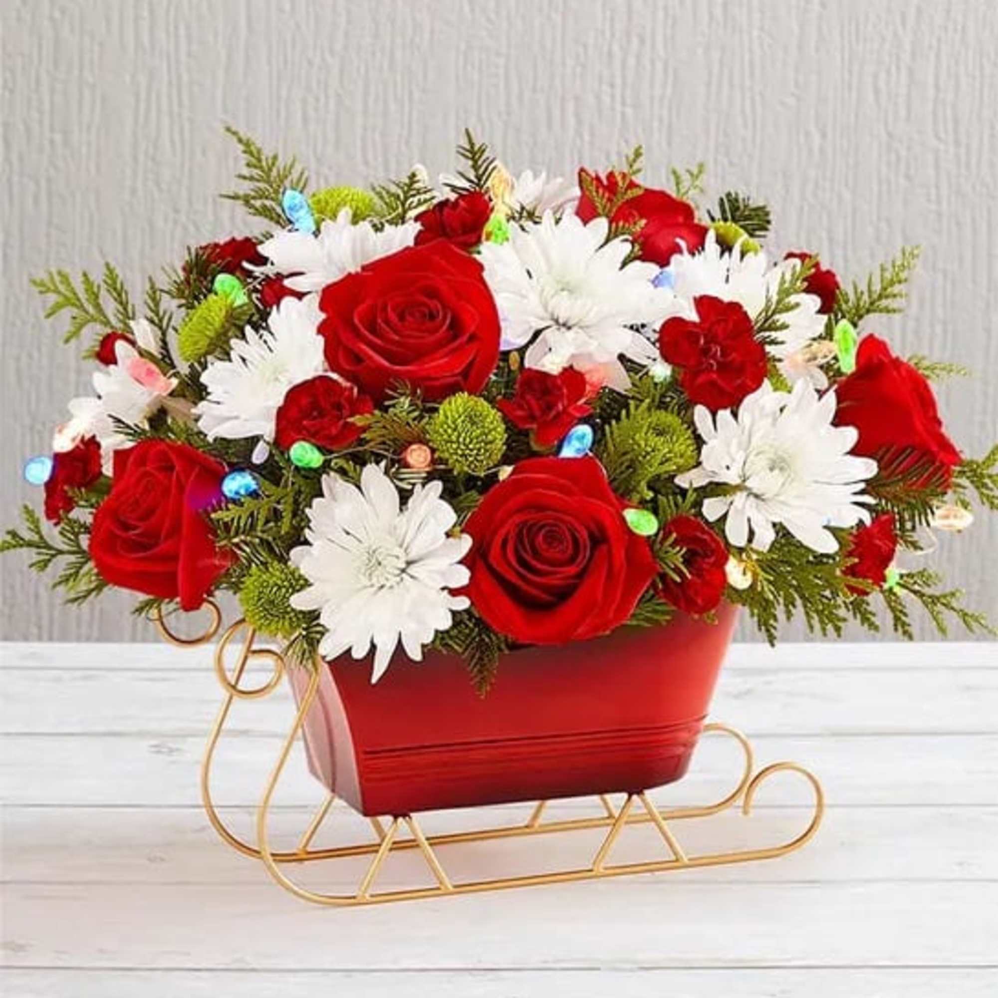 Send holiday joy their way! Our dashing arrangement is filled with classic