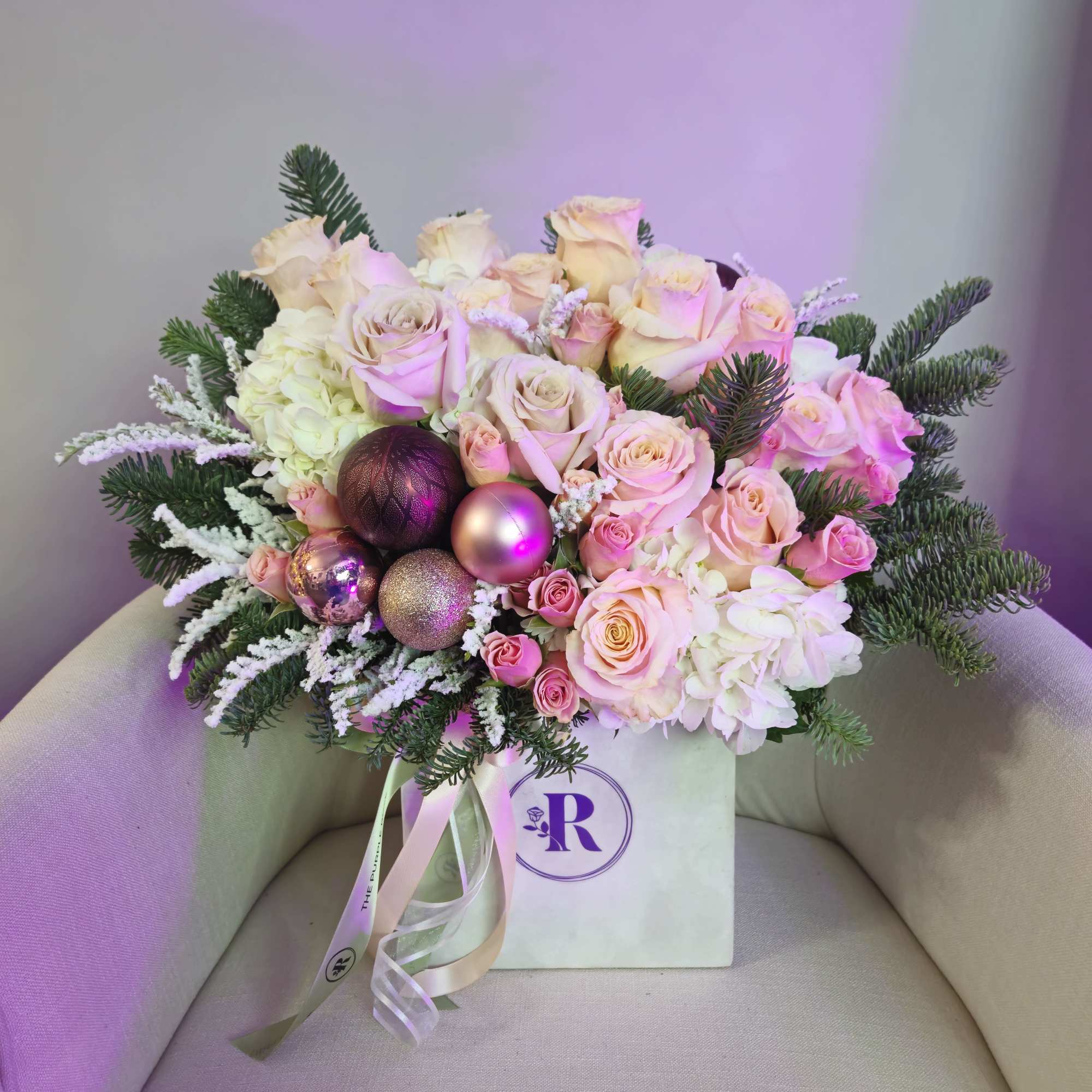 "Christmas Mood" is an arrangement with fir-tree toys in a square or