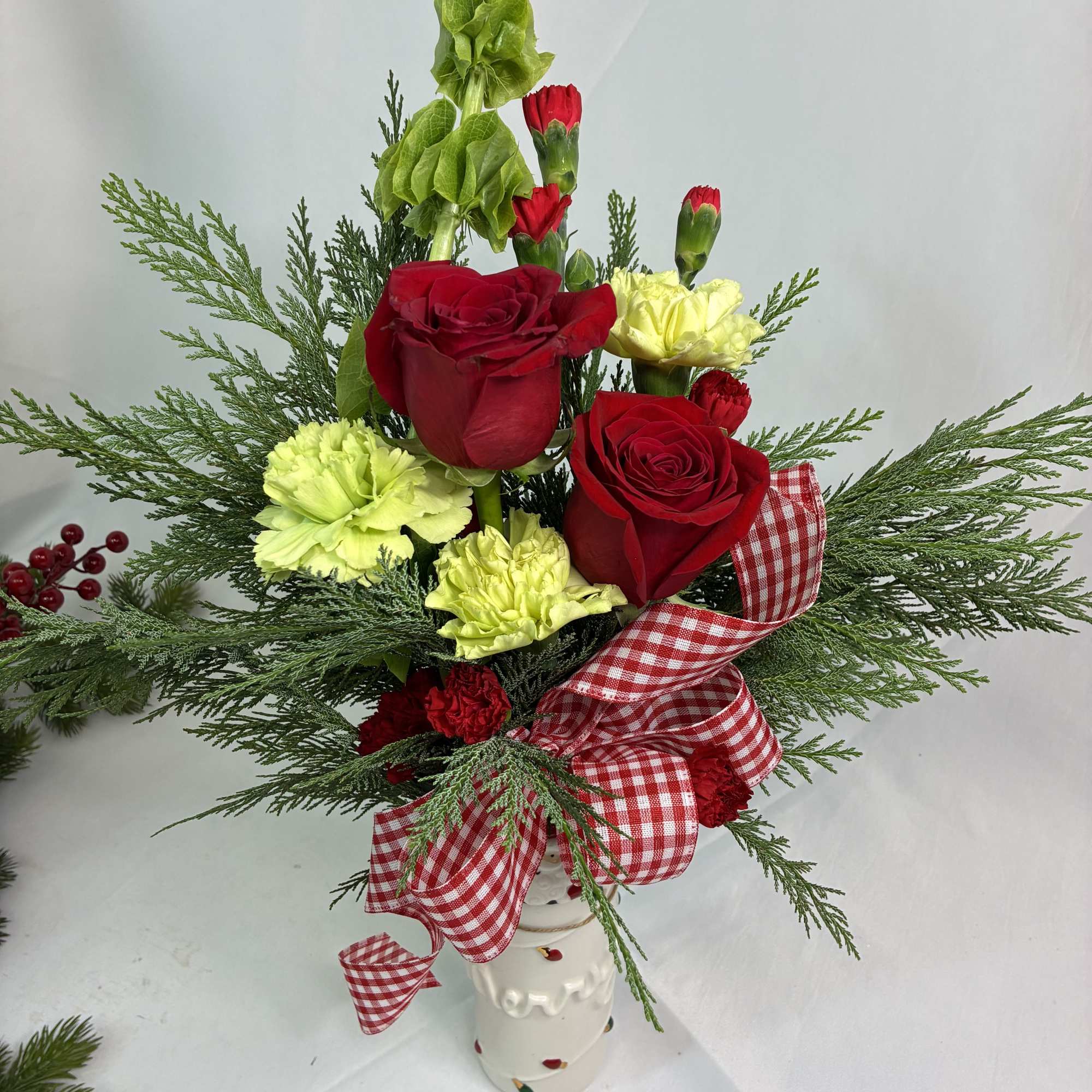 Gift a fresh Christmas bouquet in a keepsake, ceramic vase with Santa