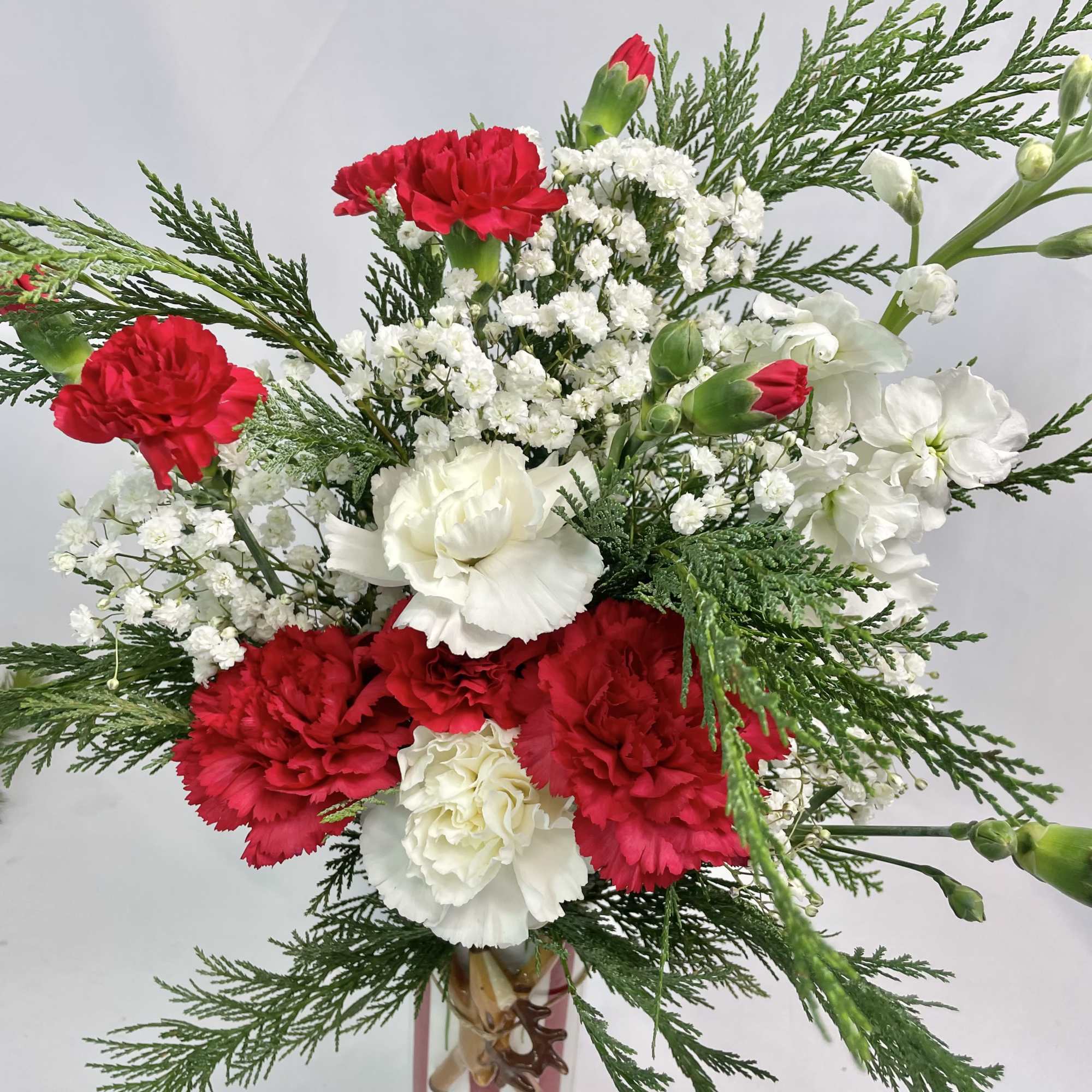 Send a holiday surprise in this keepsake, reindeer, striped vase. Make someone