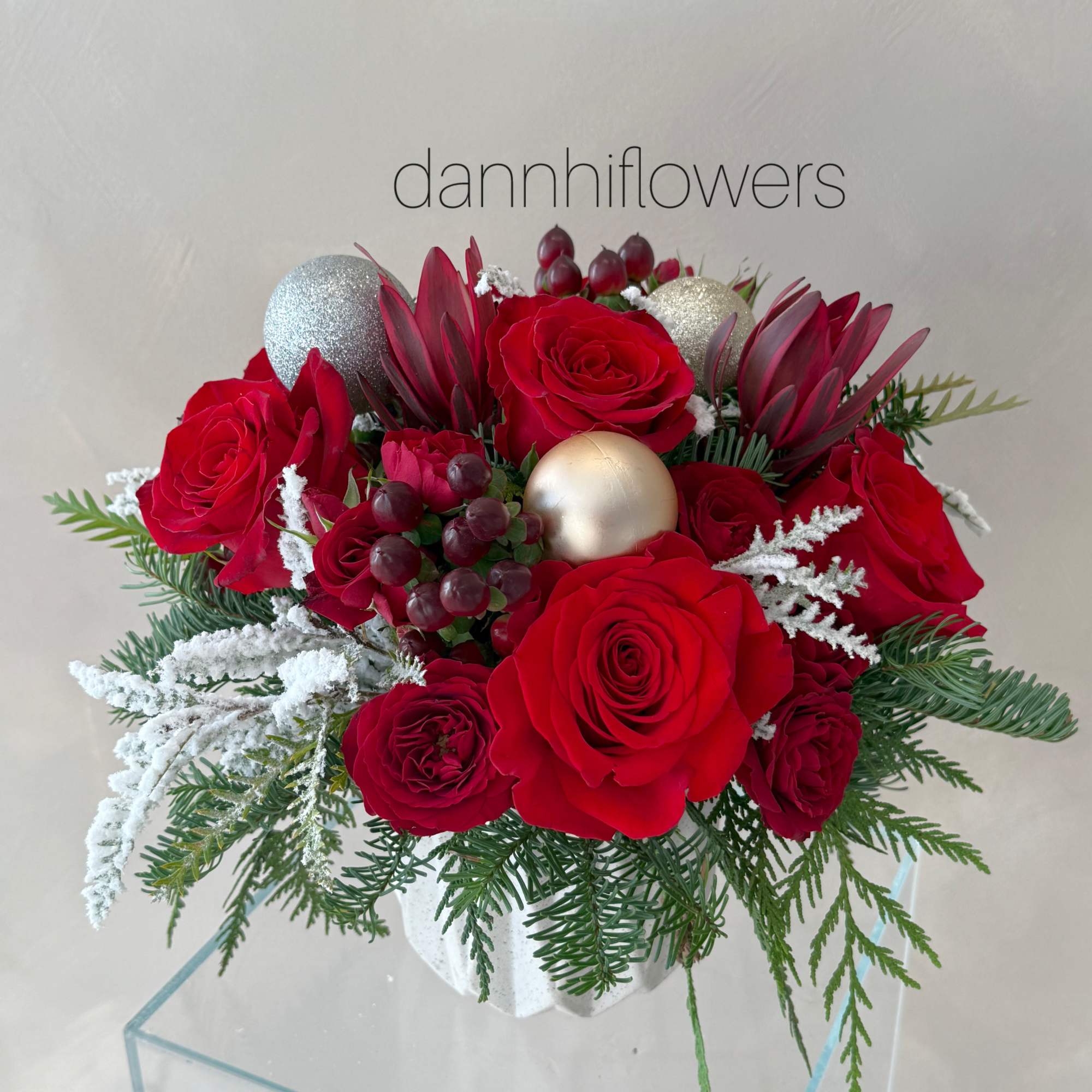 A classic holiday centerpiece designed to bring warmth and festive charm to