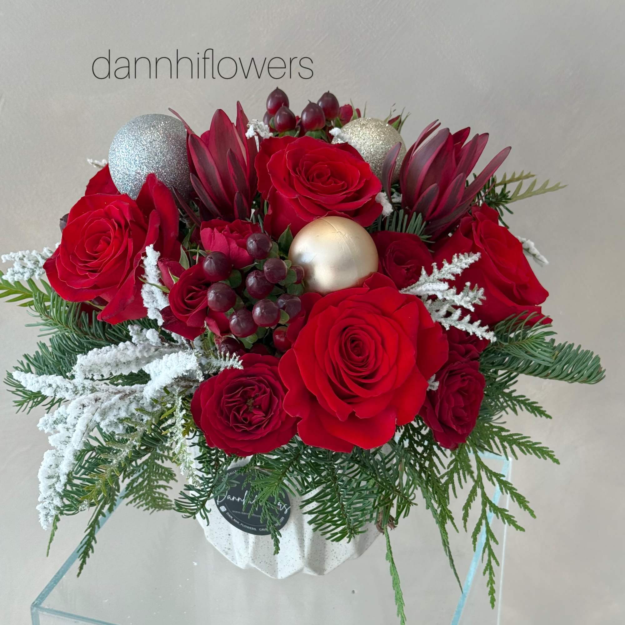 A classic holiday centerpiece designed to bring warmth and festive charm to