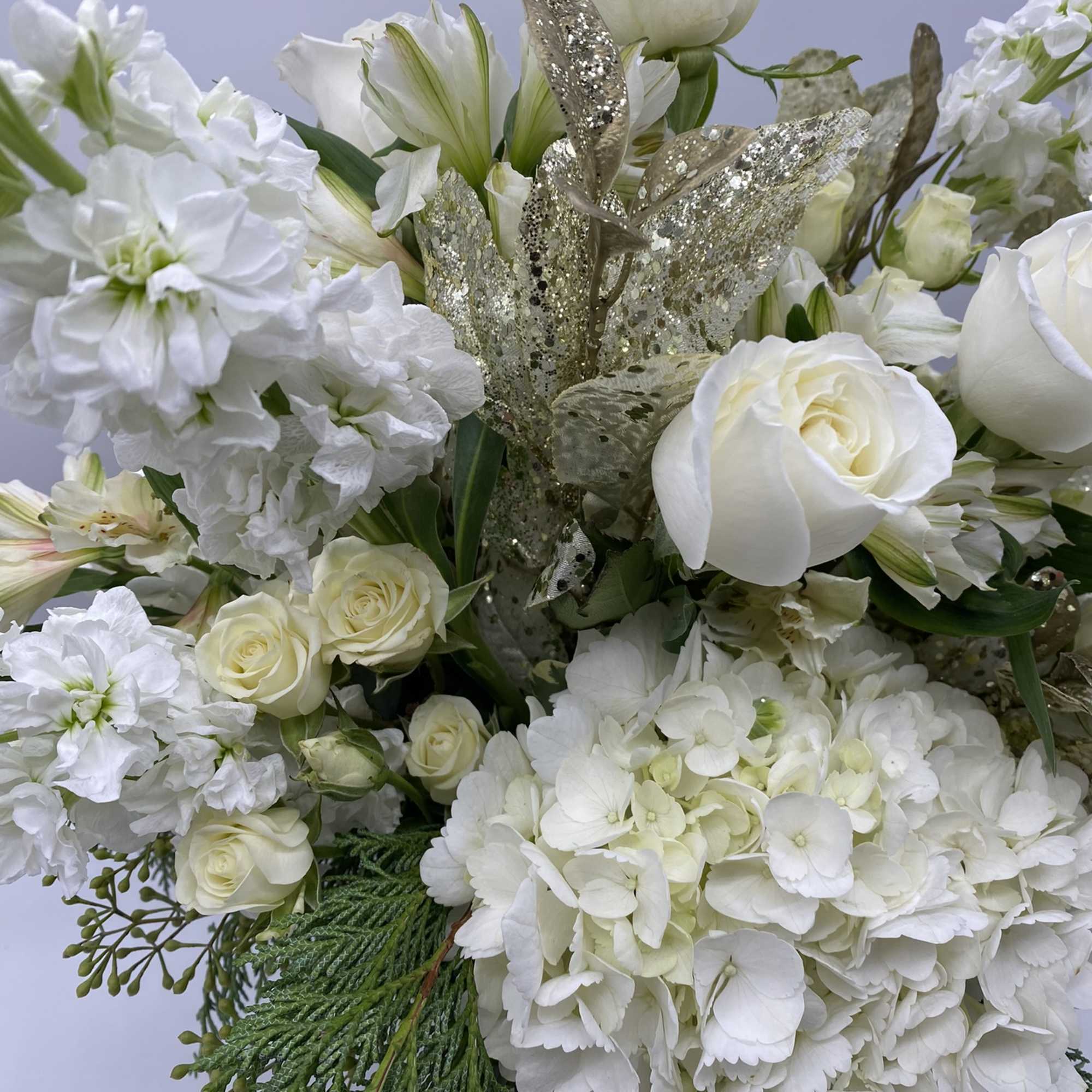 This grande arrangement has the sentiment of the season, embraced in a