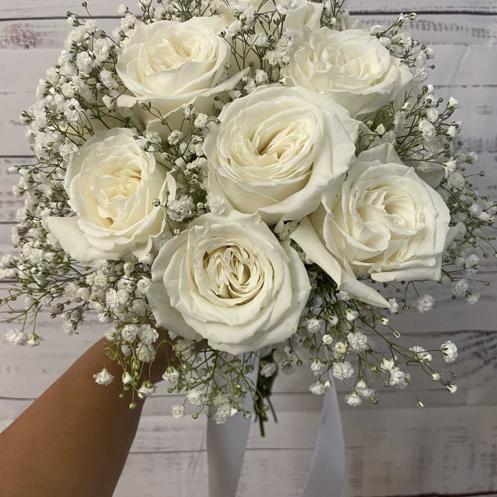 12 white roses with gyp filler 