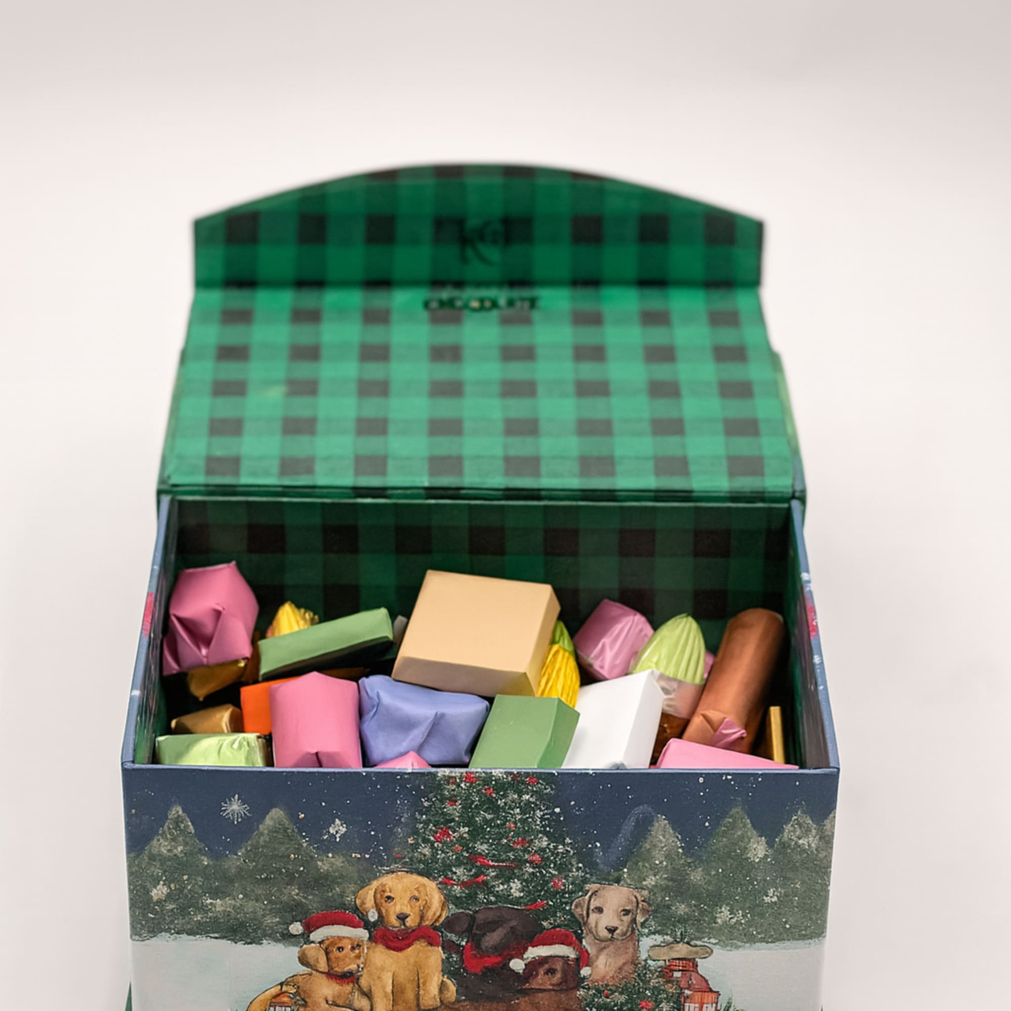 A charming holiday chocolate box wrapped in a festive winter scene featuring