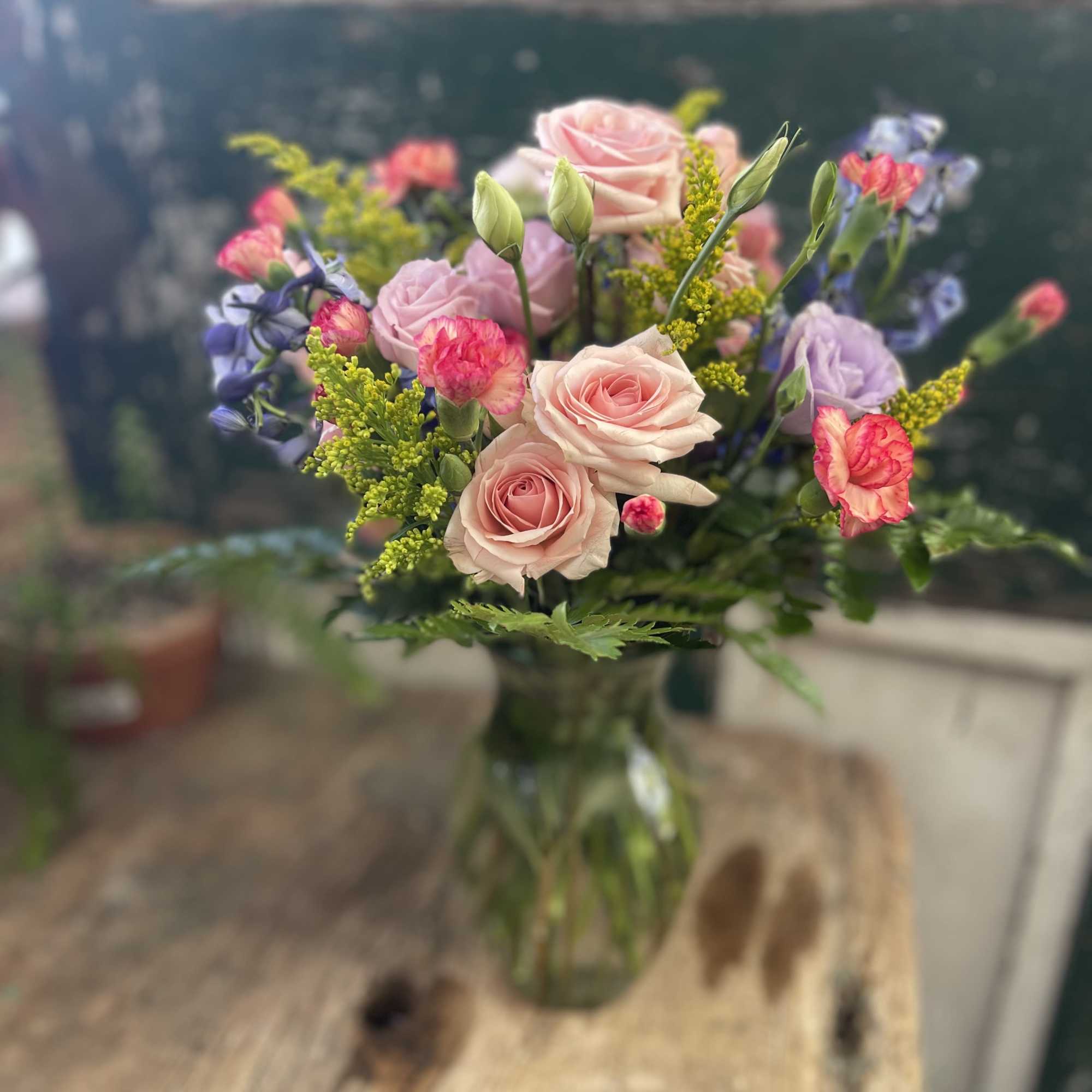 Mix the timeless beauty of lipstick-hued spray roses and lisianthus with a