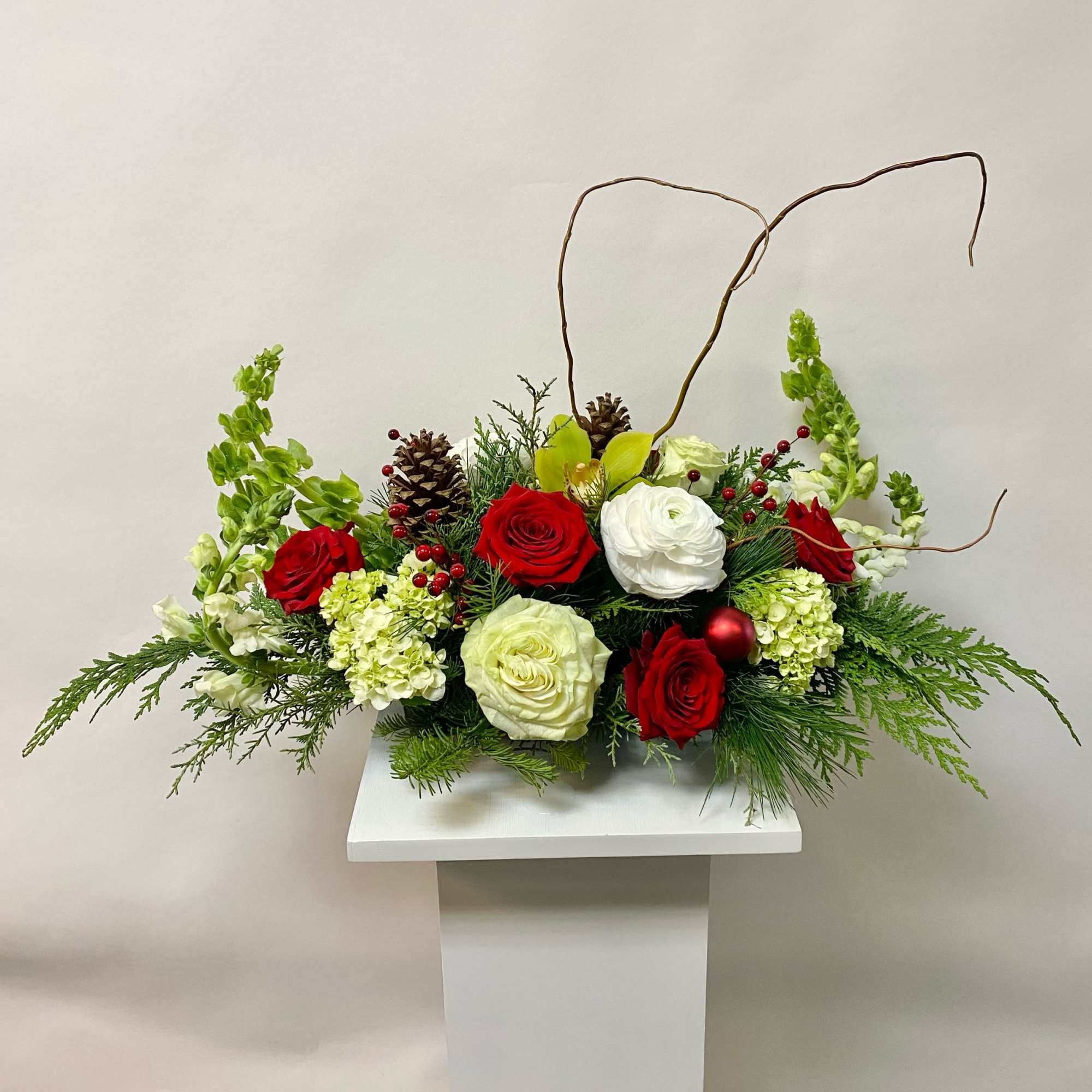 This Centerpiece Includes Bells of Ireland, White Snapdragon, White Ranunculus, Mini Green