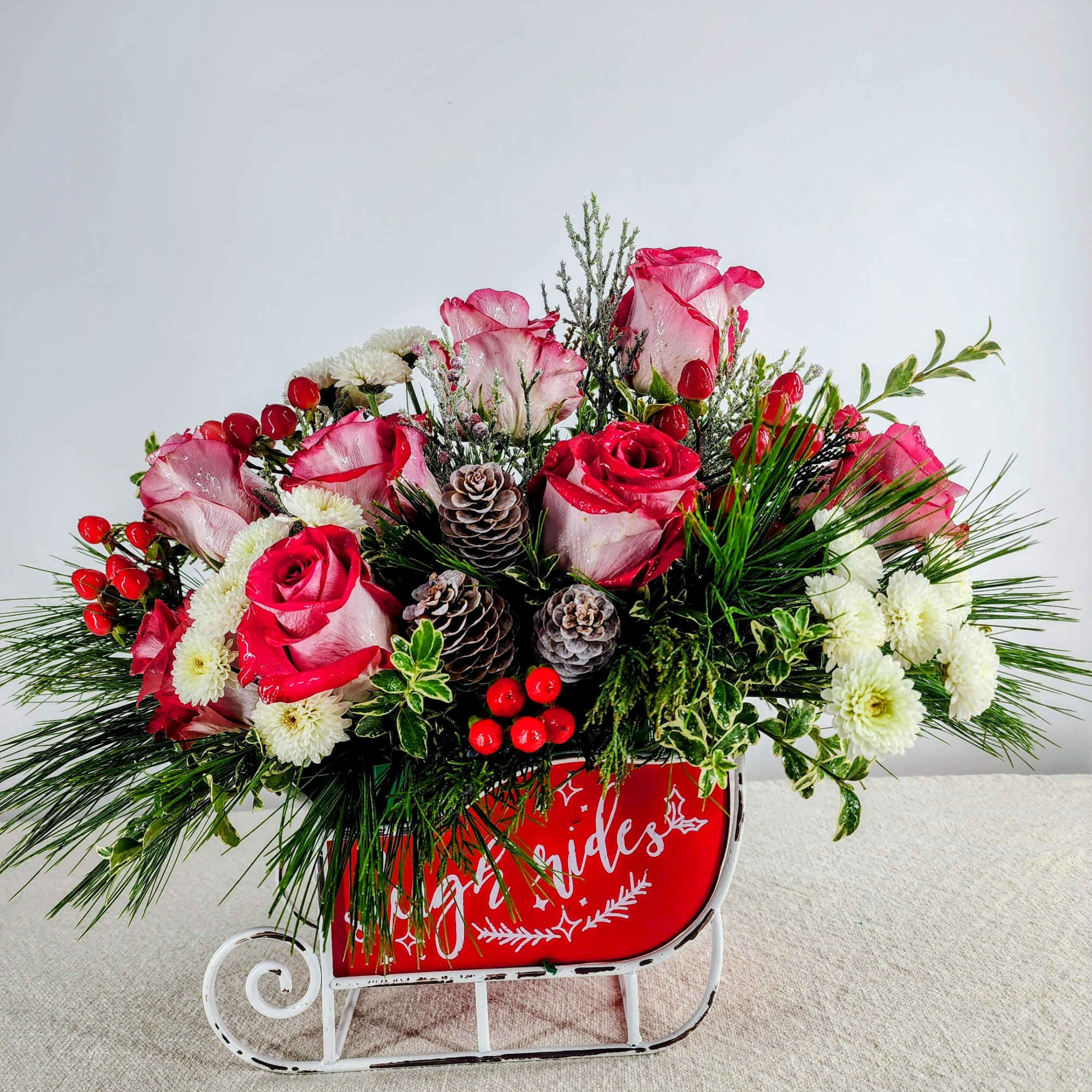 This festive sleigh embodies our Winter wonderland. It is adorned with roses