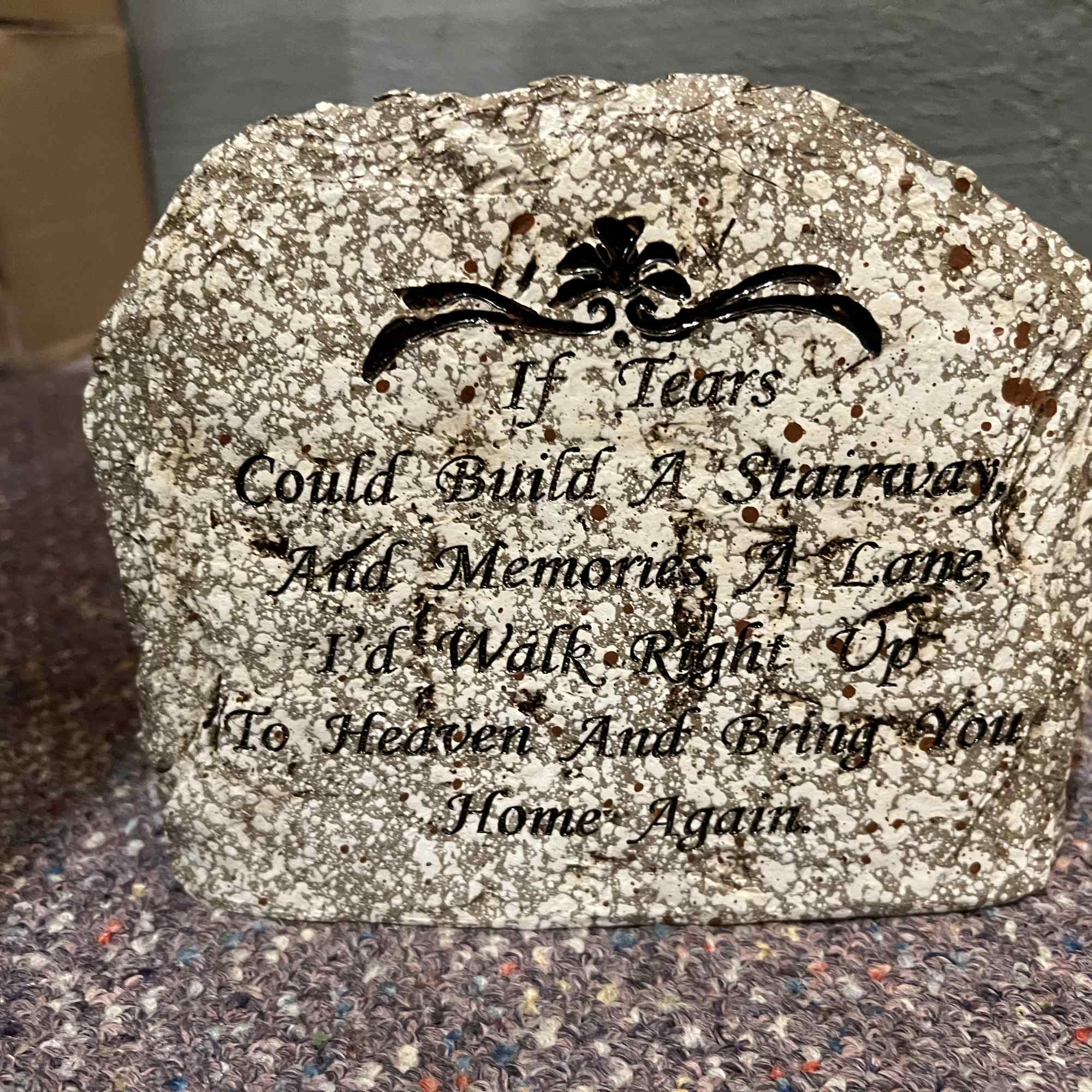A memorial garden stone. Shown here with silk accents. (Not included) Free