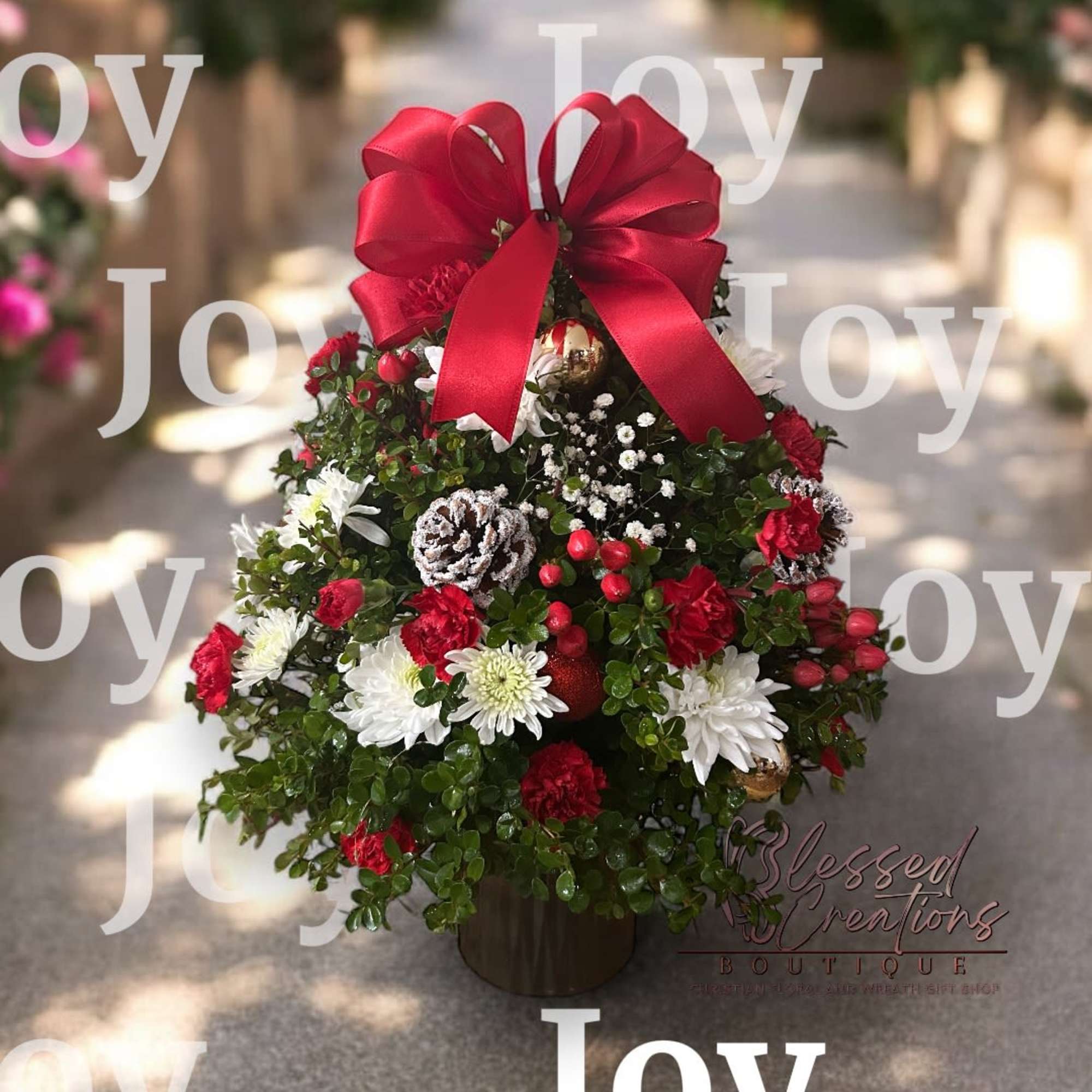 This charming fresh floral Christmas tree is beautifully handcrafted with lush greenery