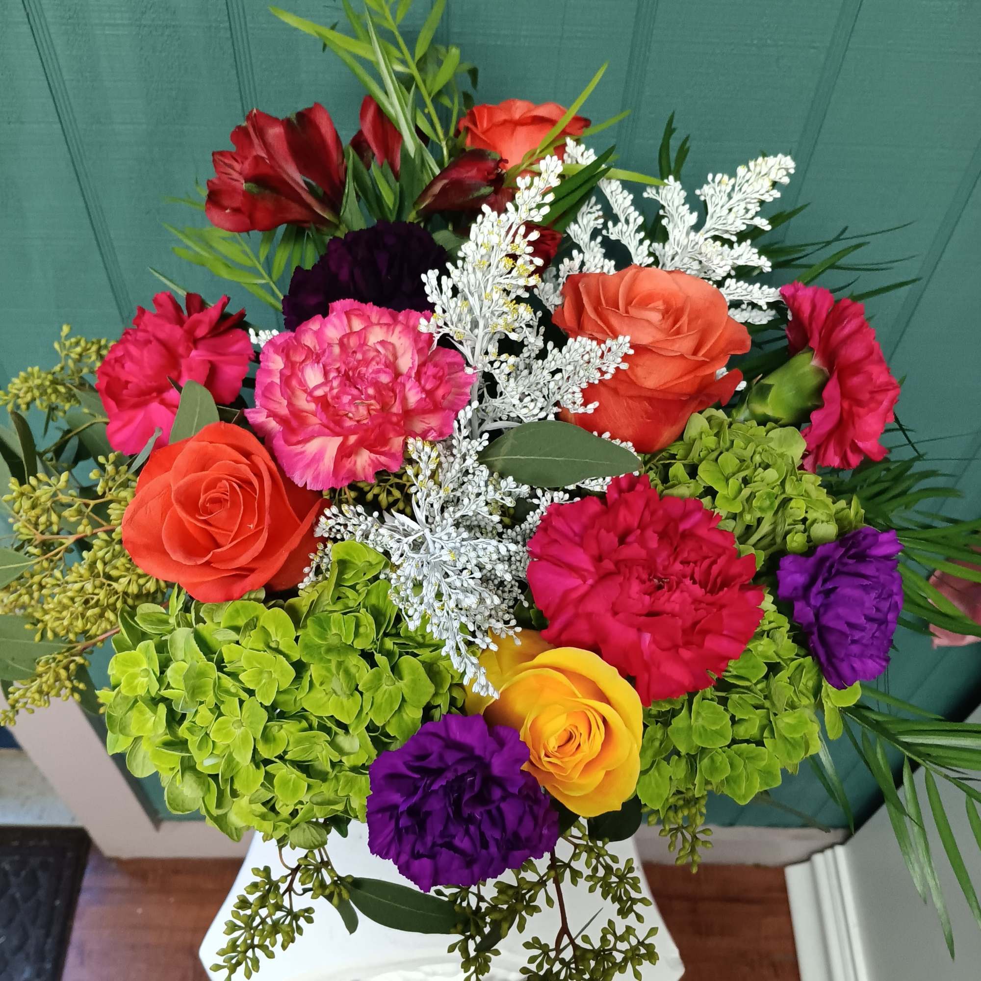 A playful explosion of color, the "Skittles" arrangement radiates joy with its