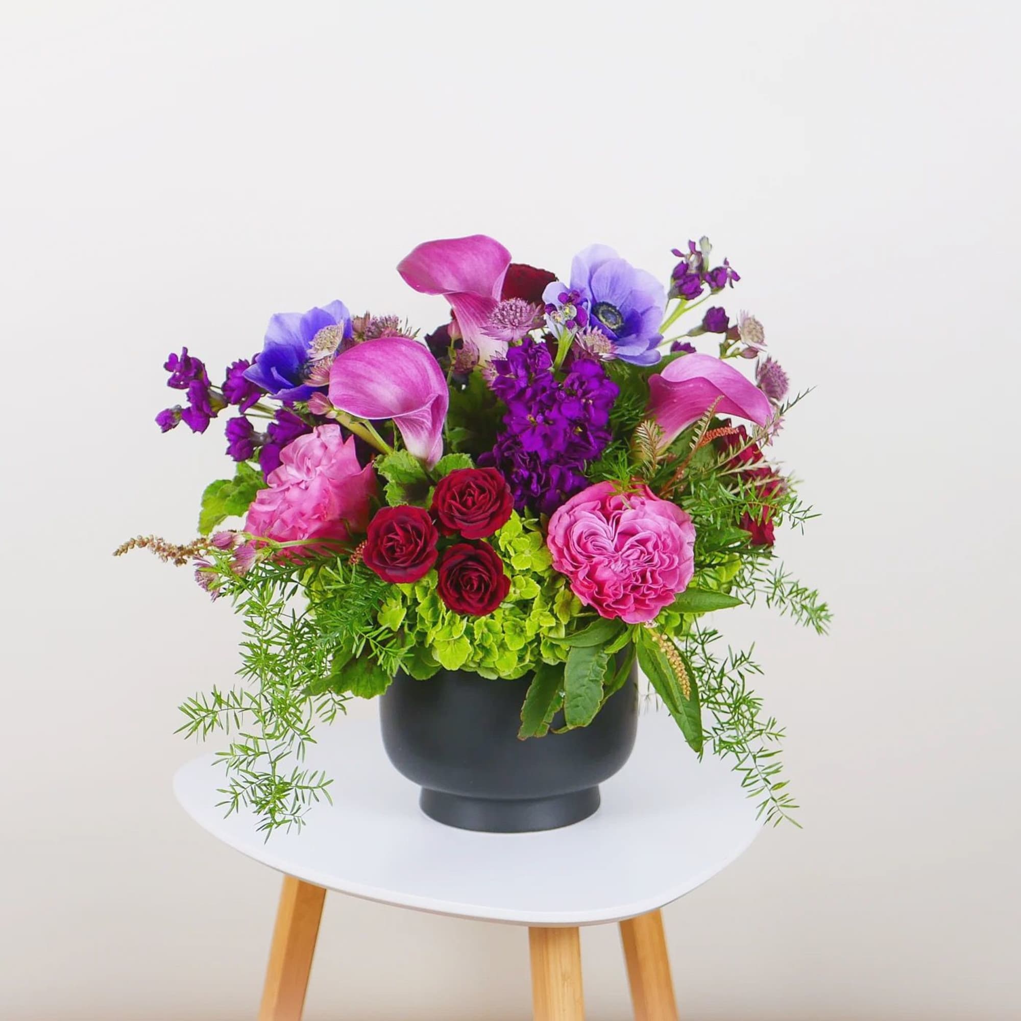 Order a Designer's Choice arrangement in stunning jewel tones! Our expert florists
