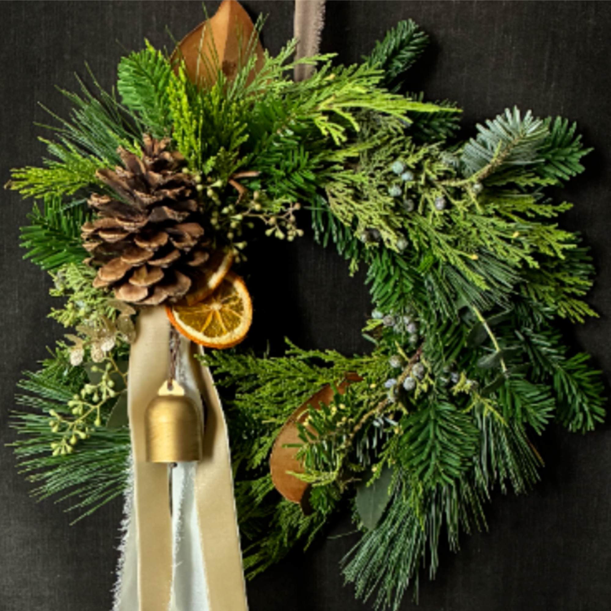 The Ivory &amp; Ember Wreath features burnt sienna tones, soft ivory ribbon