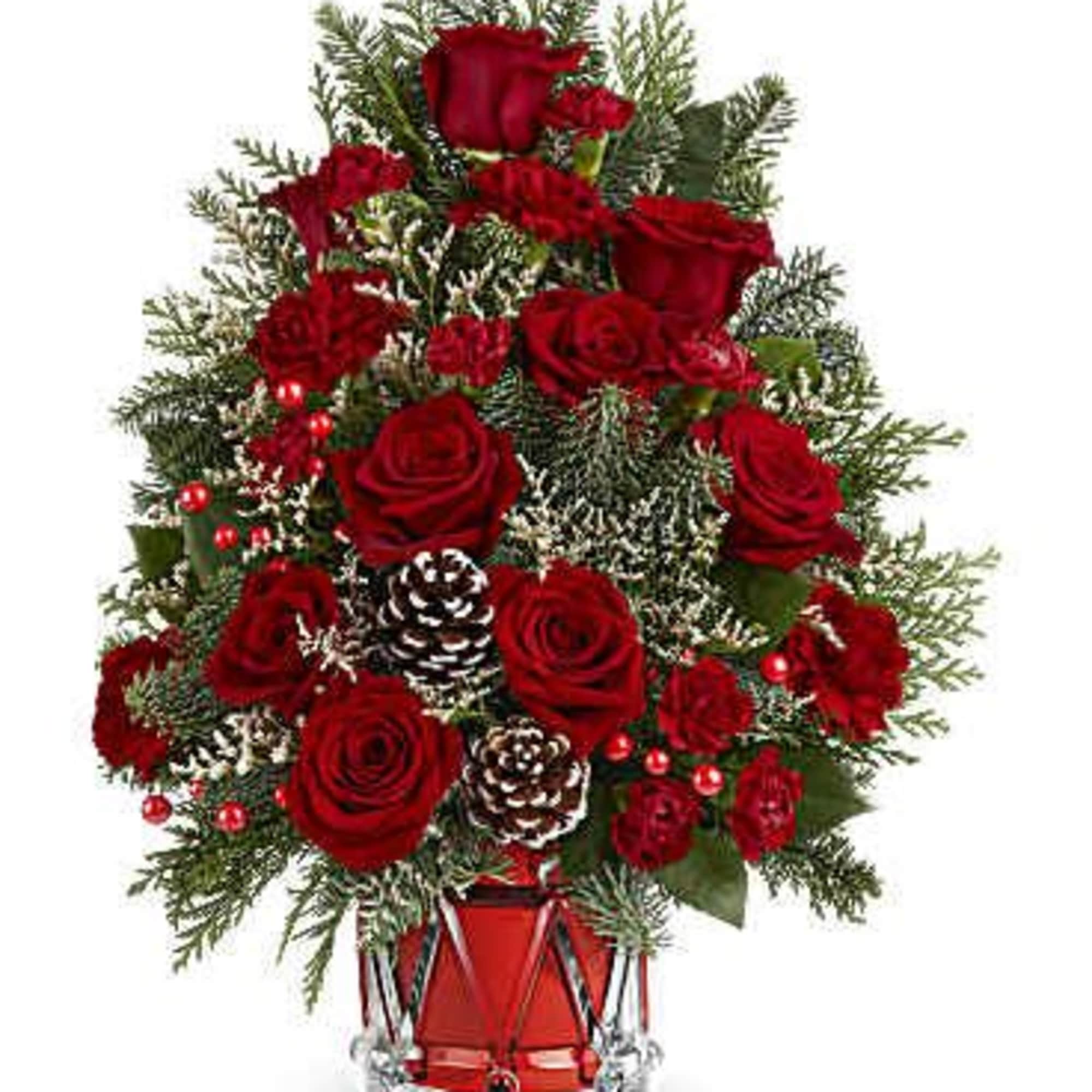 Teleflora's Yuletide Sparkle Tree is a festive floral Christmas tree made of