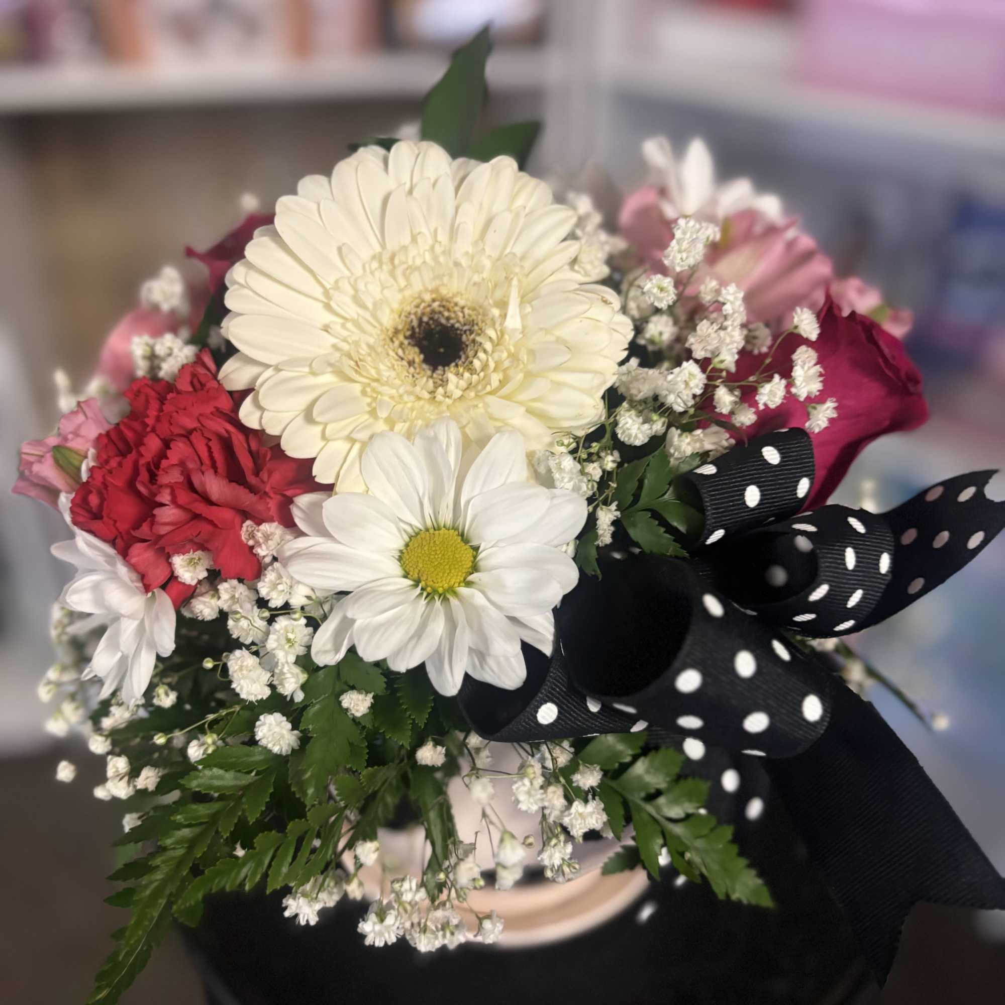 Fresh flowers in polka  dot vase 