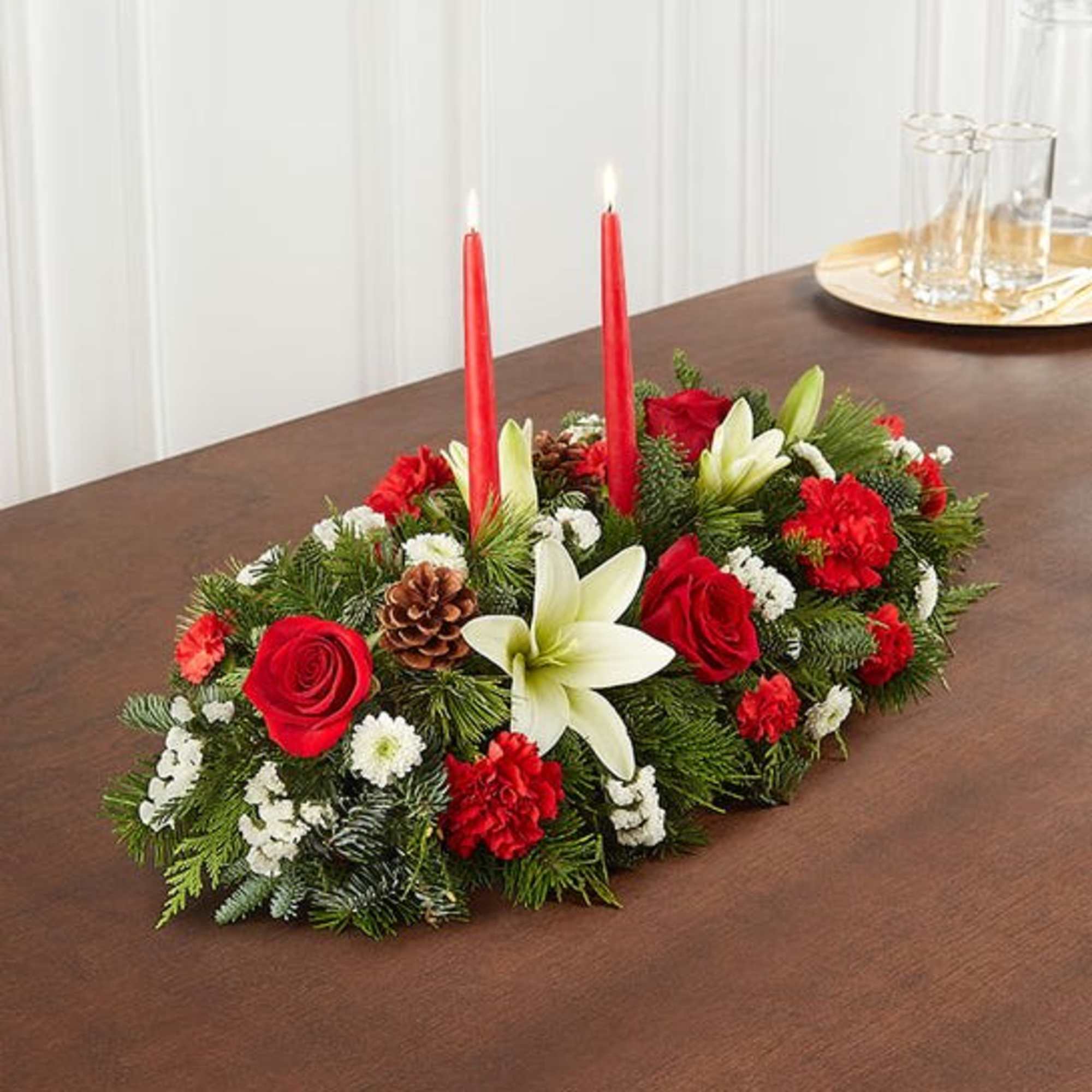 Our traditional table arrangement creates the perfect centerpiece for your Christmas celebration.