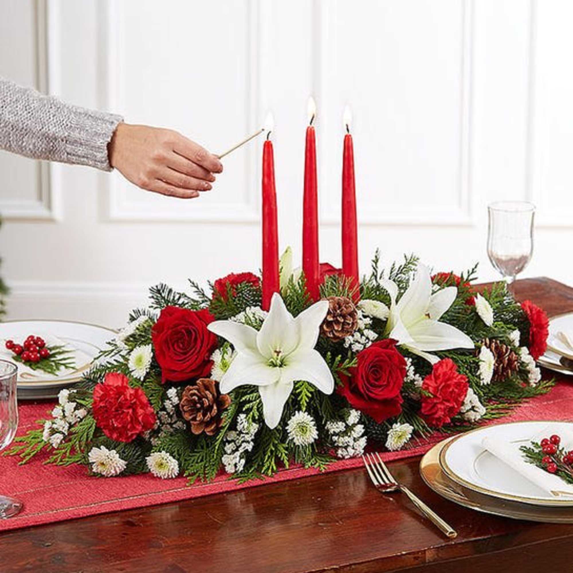 Our traditional table arrangement creates the perfect centerpiece for your Christmas celebration.