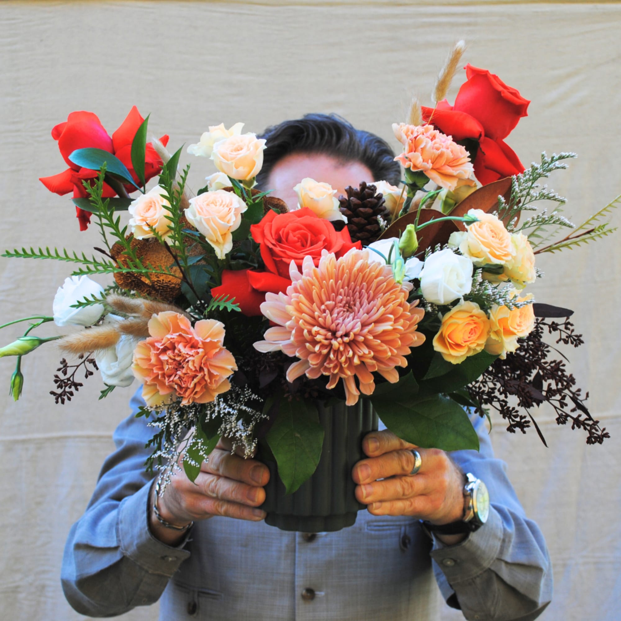 Merry &amp; Bright is a modern arrangement artfully designed in ceramic pot