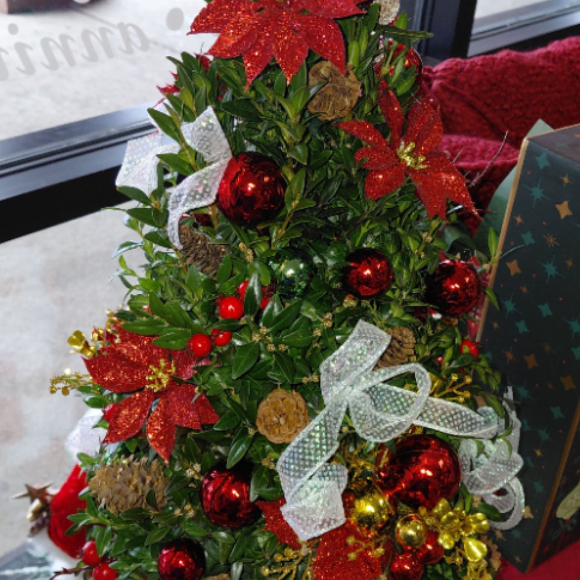 Discover the artistry of the holiday season!  Hand-made Boxwood Trees, crafted
