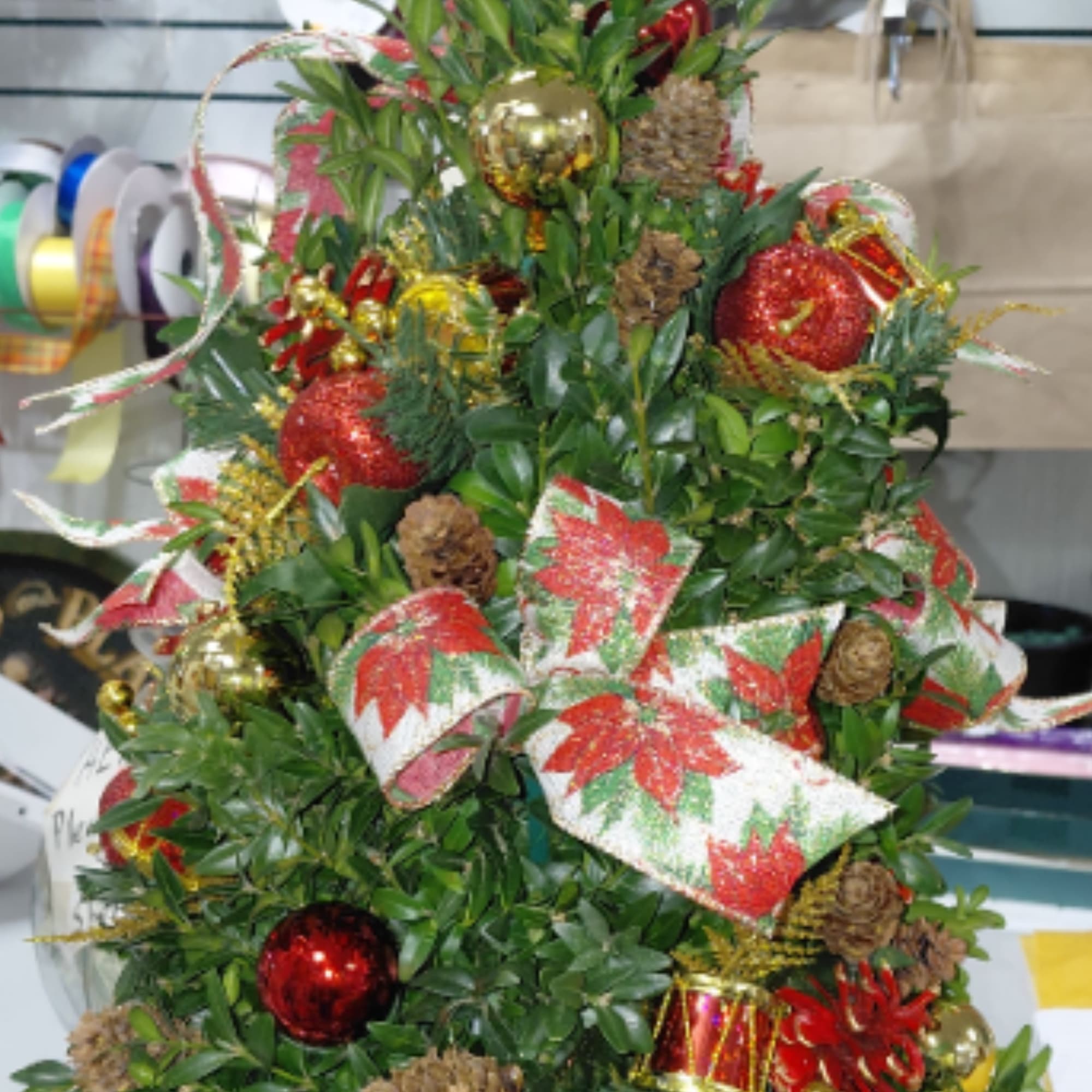 Discover the artistry of the holiday season!  Hand-made Boxwood Trees, crafted