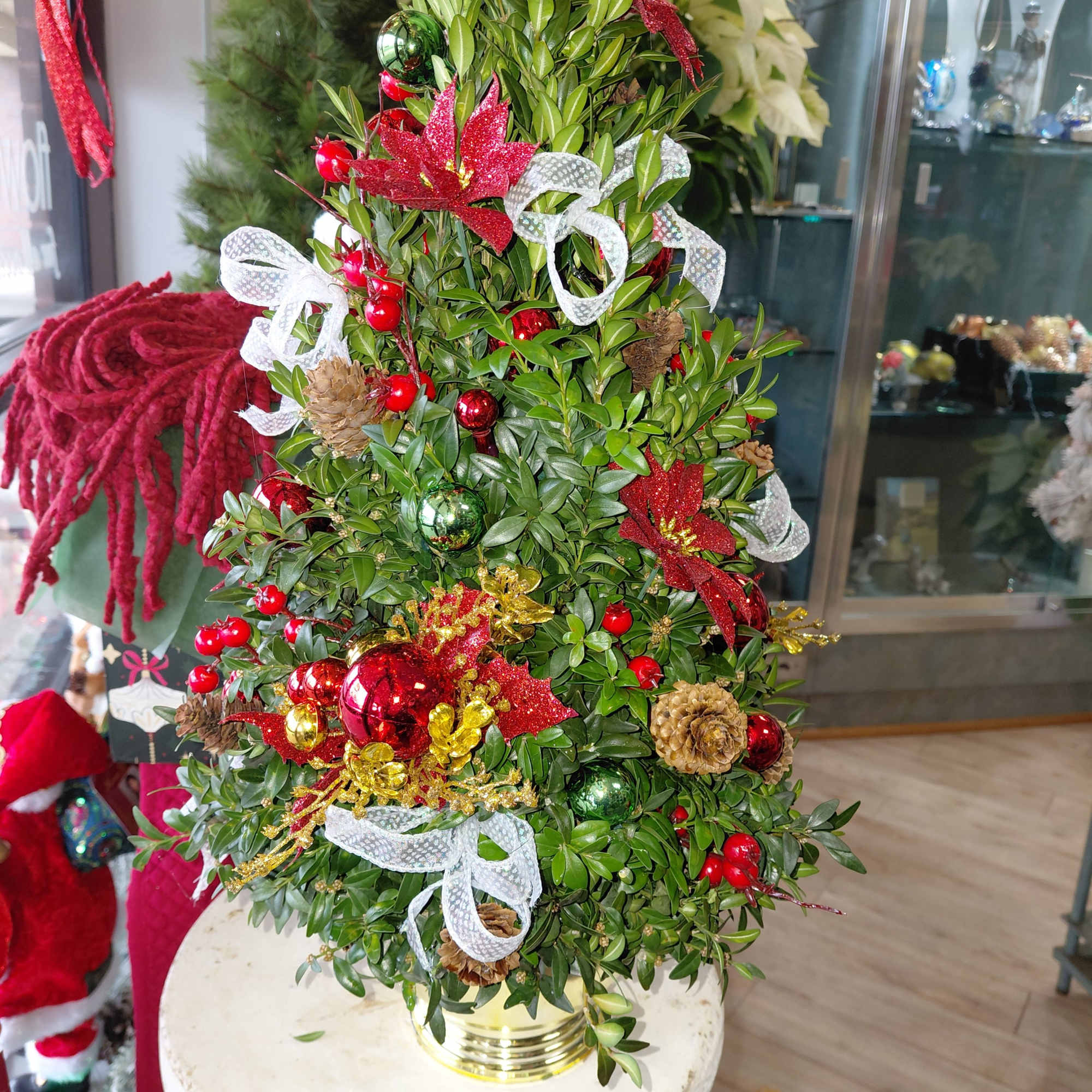 Discover the artistry of the holiday season!  Hand-made Boxwood Trees, crafted