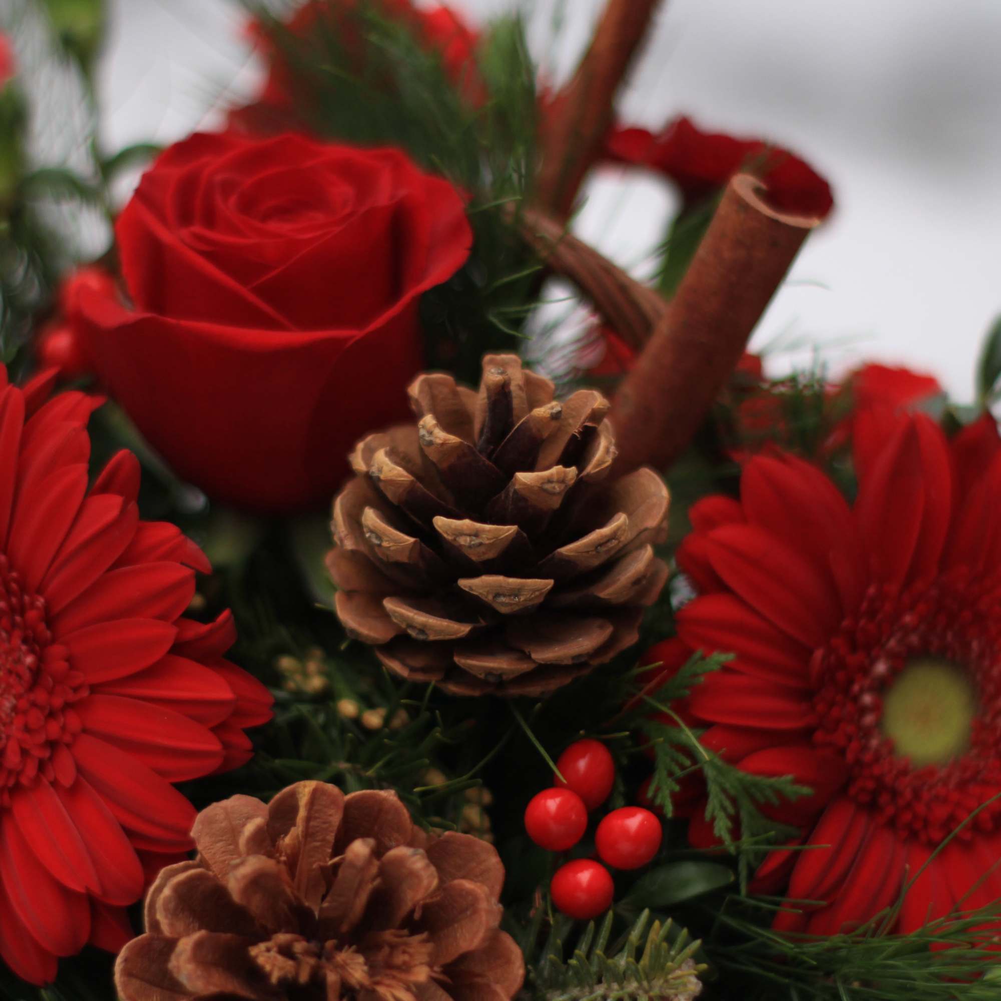 Berries and spice and everything nice make this arrangement a wonderful holiday