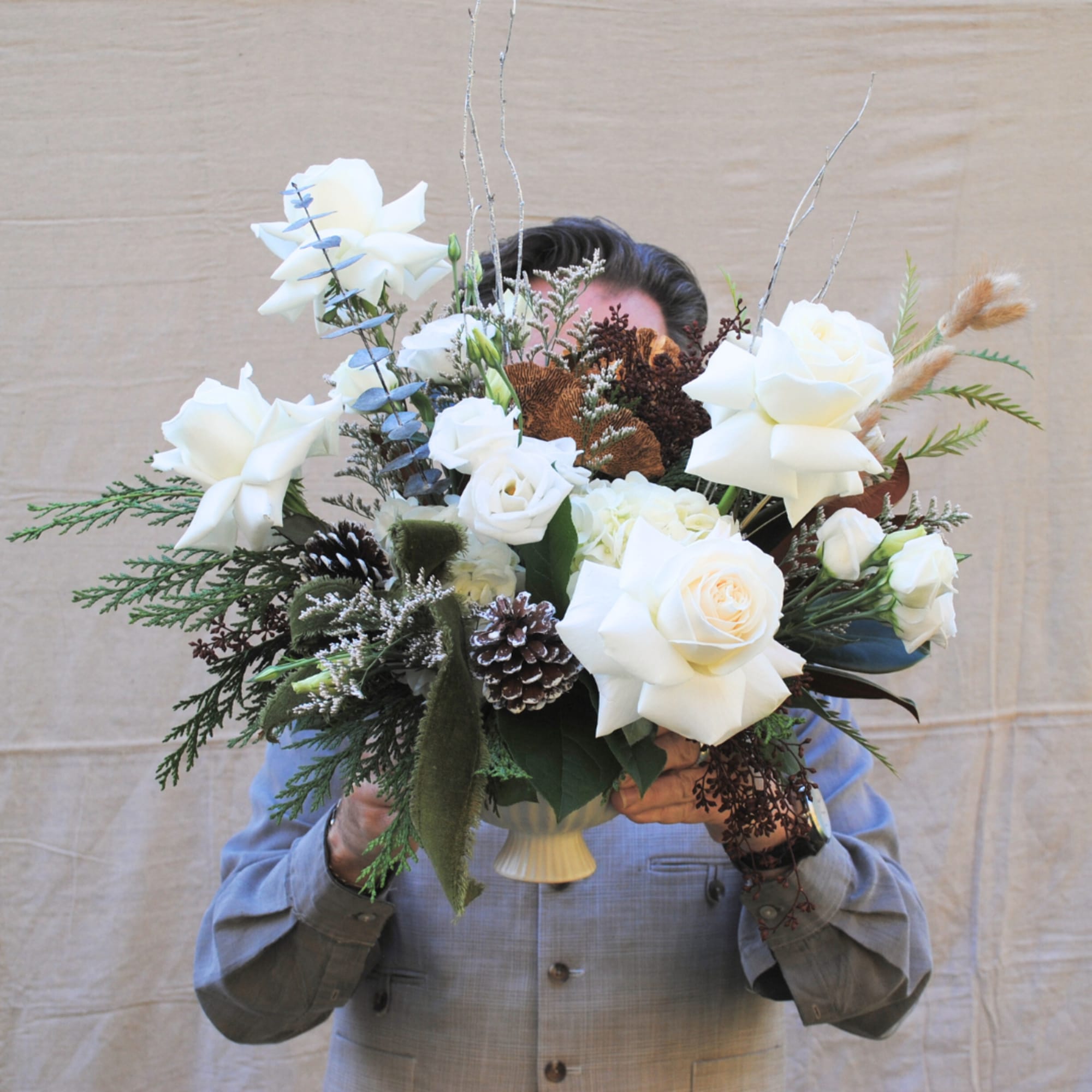 Linus &amp; Lucy is a modern arrangement artfully designed in ceramic pot