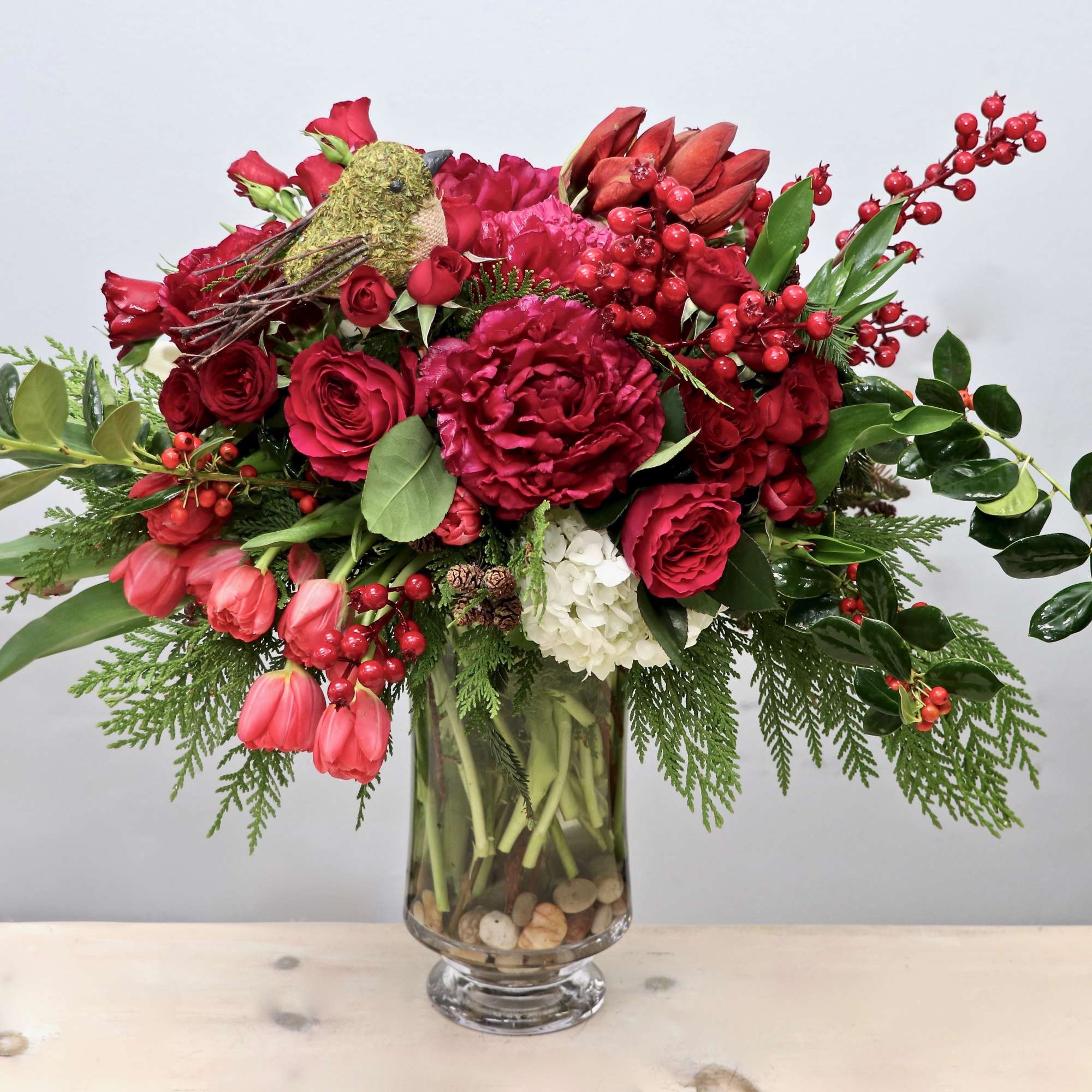 All the holiday greats; Peonies, tulips, and amaryllis. This arrangement is without