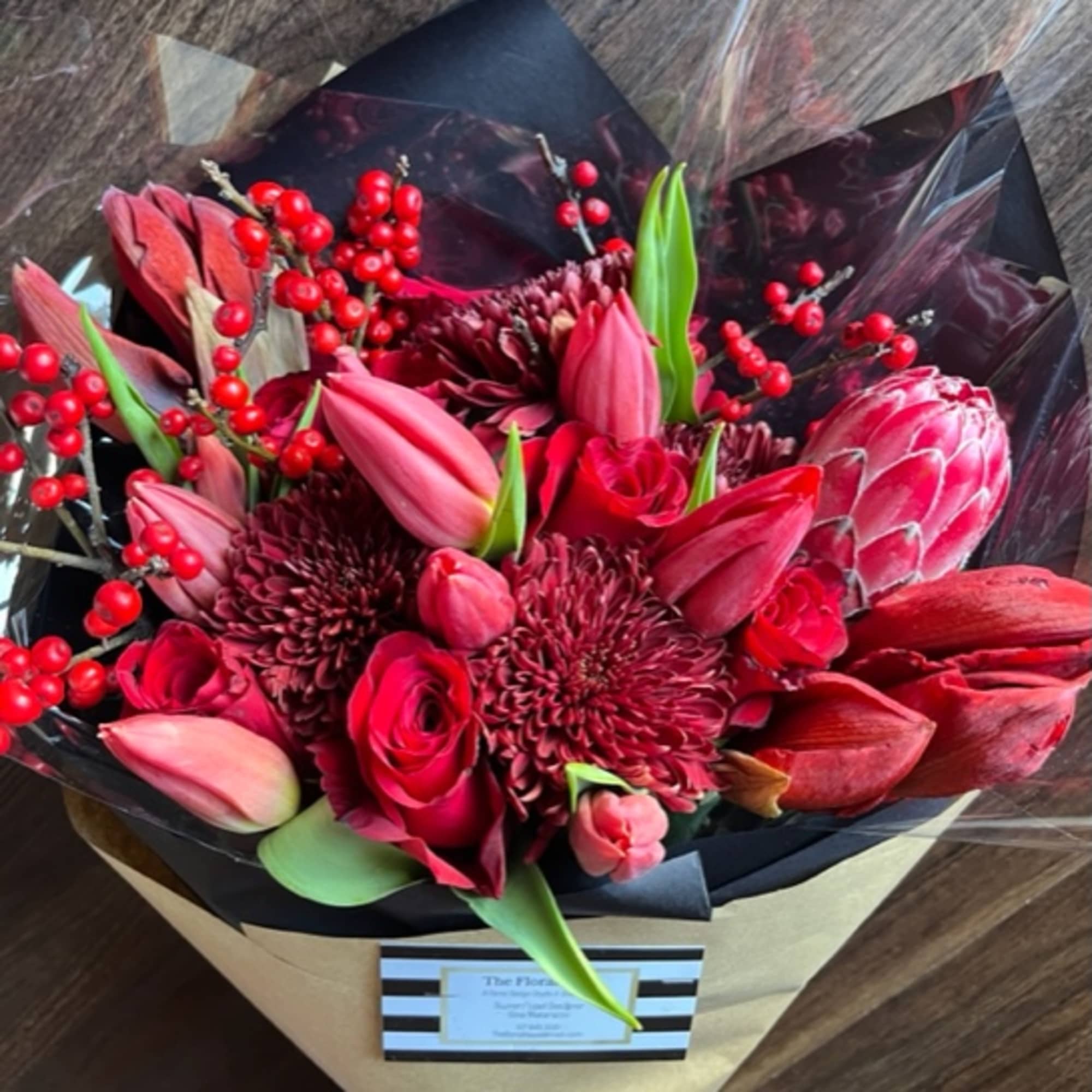 Send some love and cheer with this bold red bouquet of seasonal