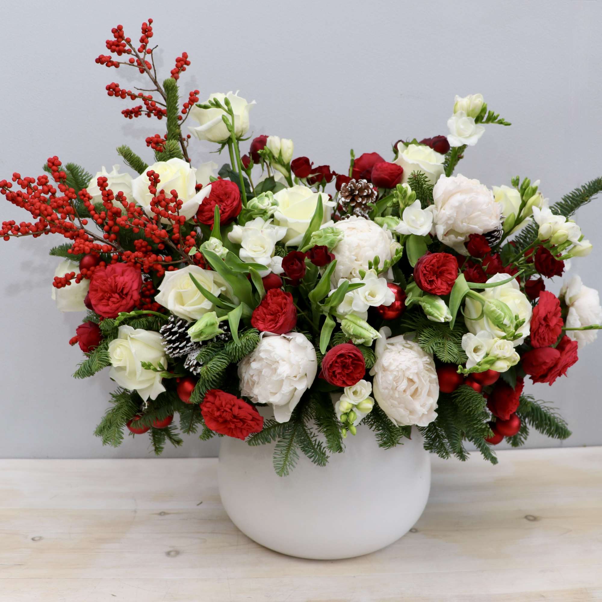 This large arrangement is a holiday show stopper! It's made with gorgeous