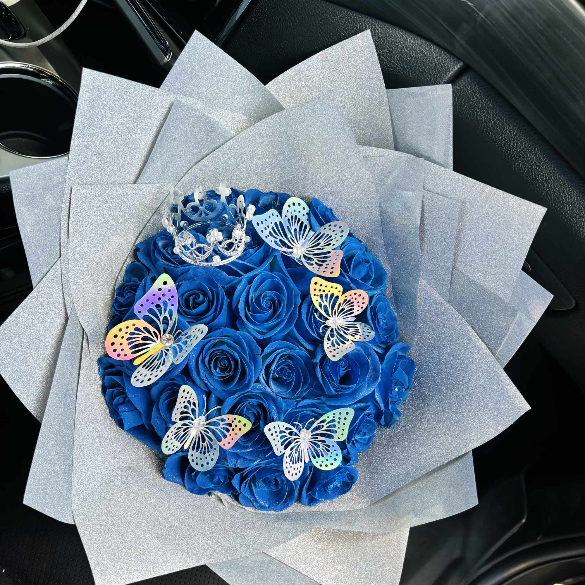 Bouquet comes with crown and butterflies. Colors of accessories such as paper
