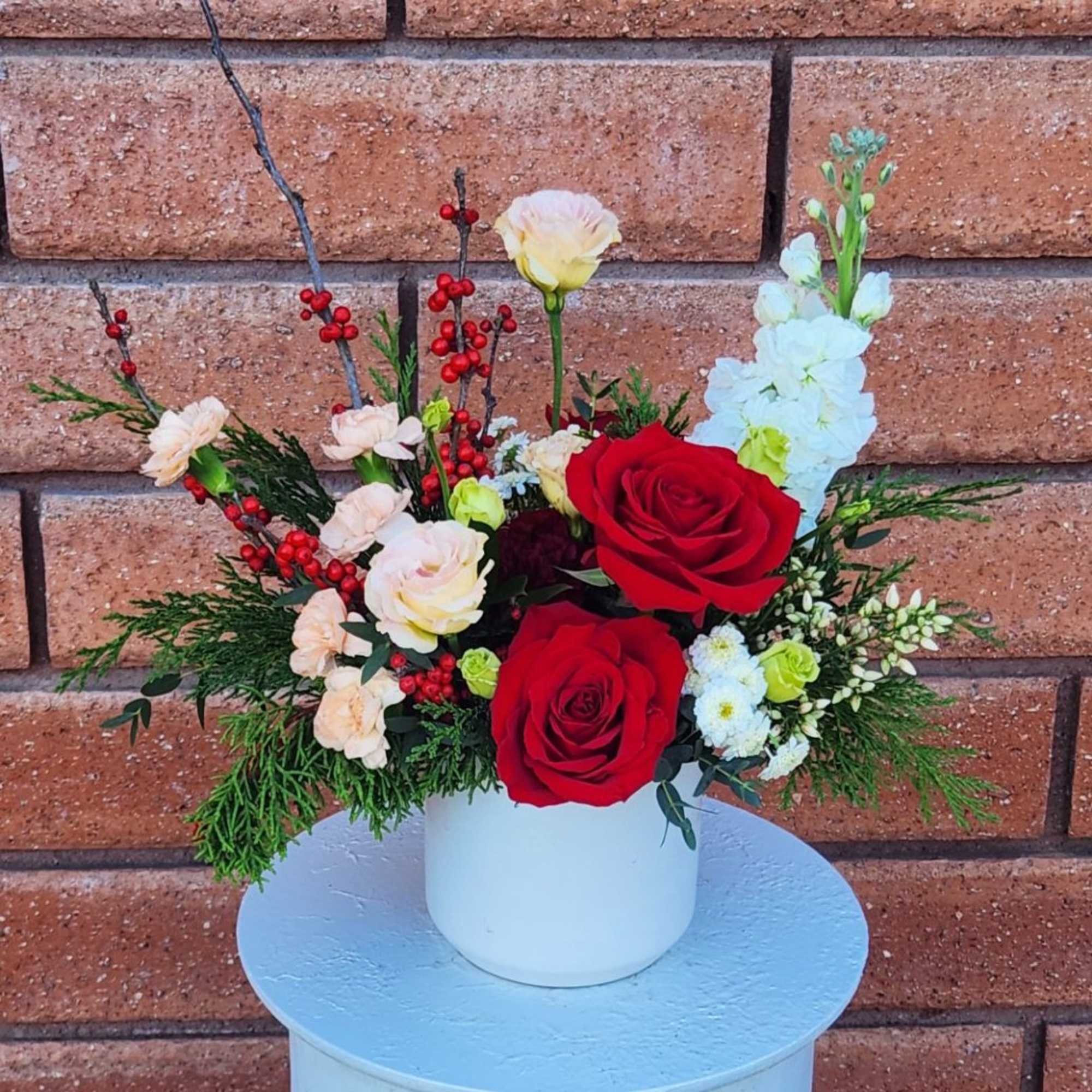 Holiday Cheer Floral Arrangement

Bring warmth and festive elegance to any space with