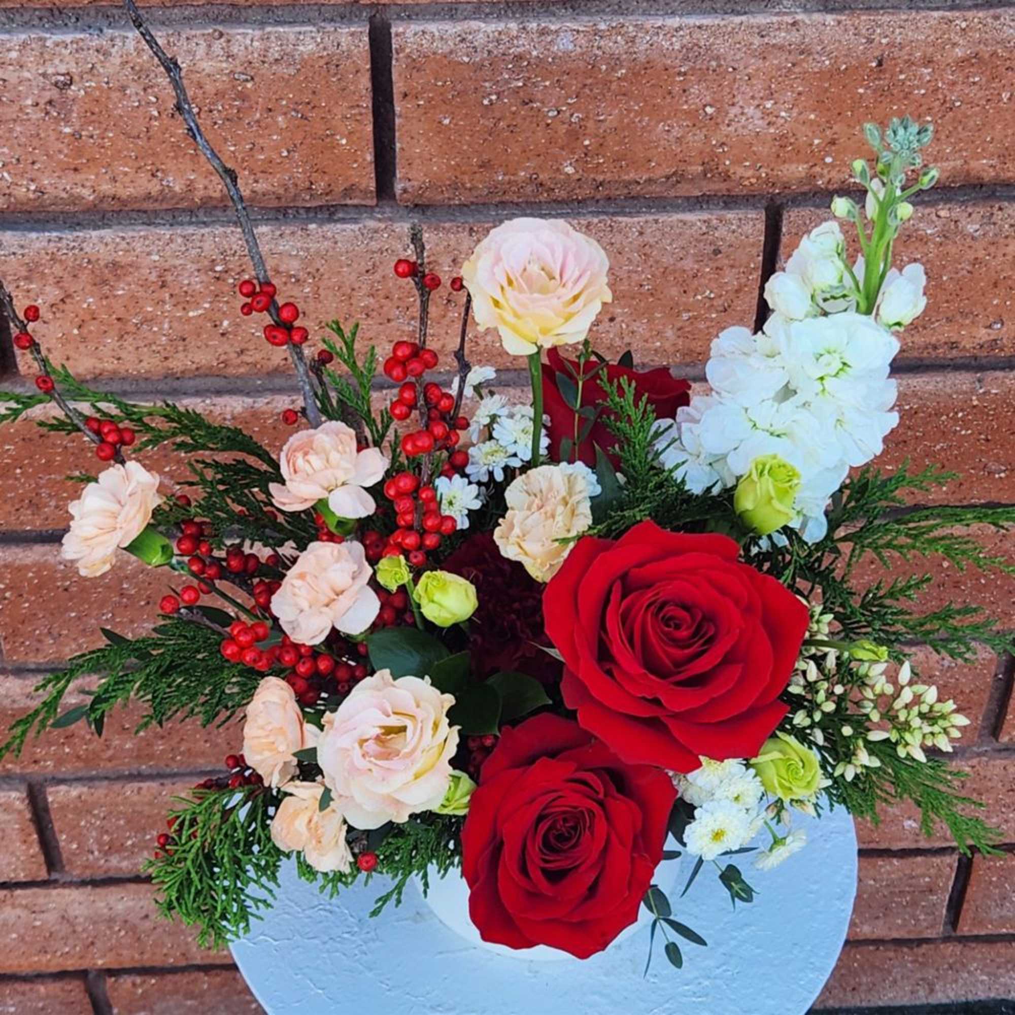 Holiday Cheer Floral Arrangement

Bring warmth and festive elegance to any space with