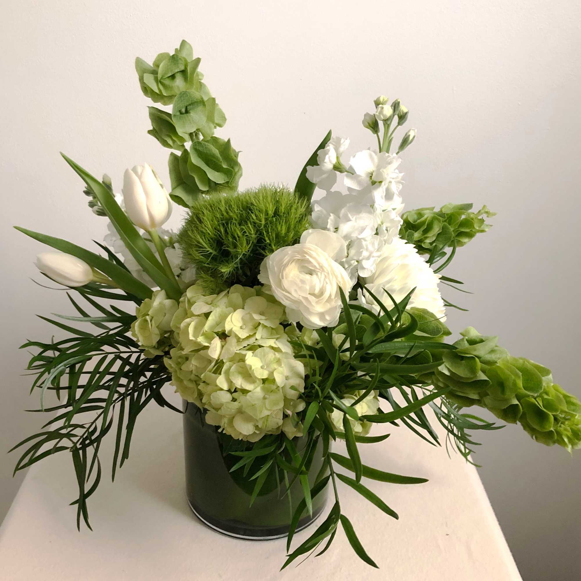 Classic and bold,  Martini a garden-style arrangement with white and green