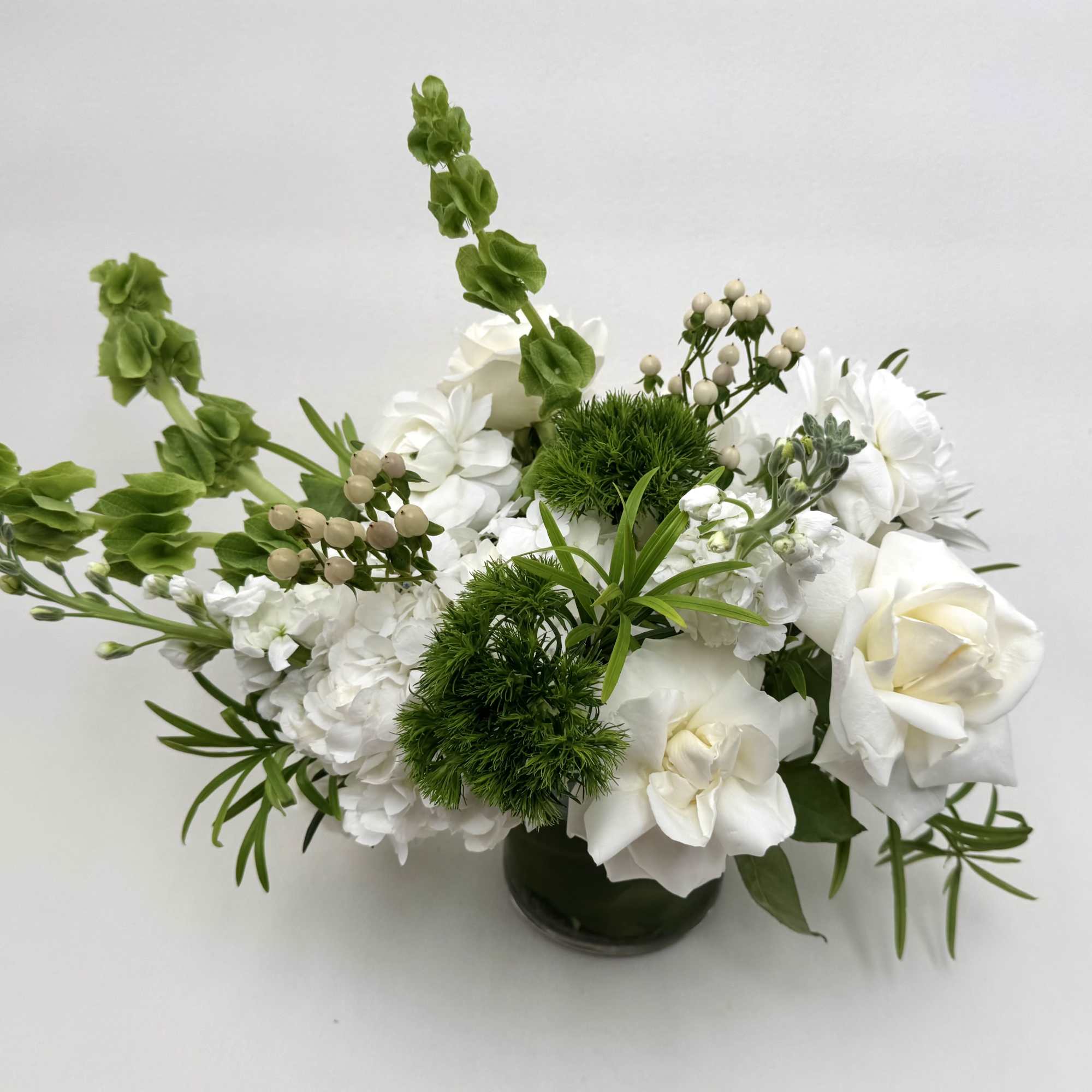 Classic and bold,  Martini a garden-style arrangement with white and green