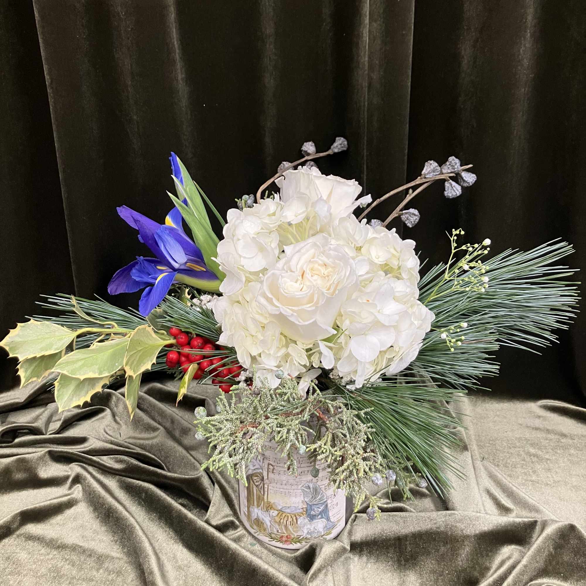 Thai arrangement features a beautiful vessel that doubles as a candle holder.