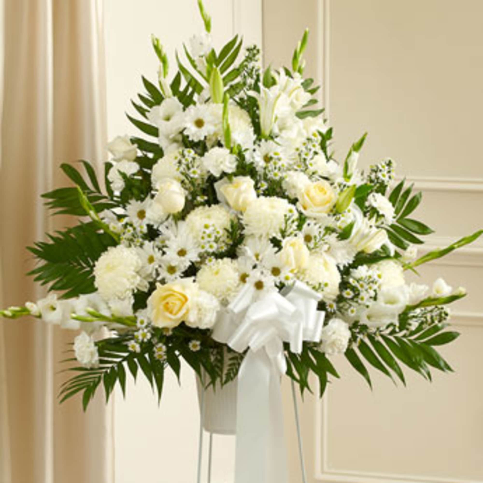 Express your heartfelt sympathies with this standing basket, filled with pure and