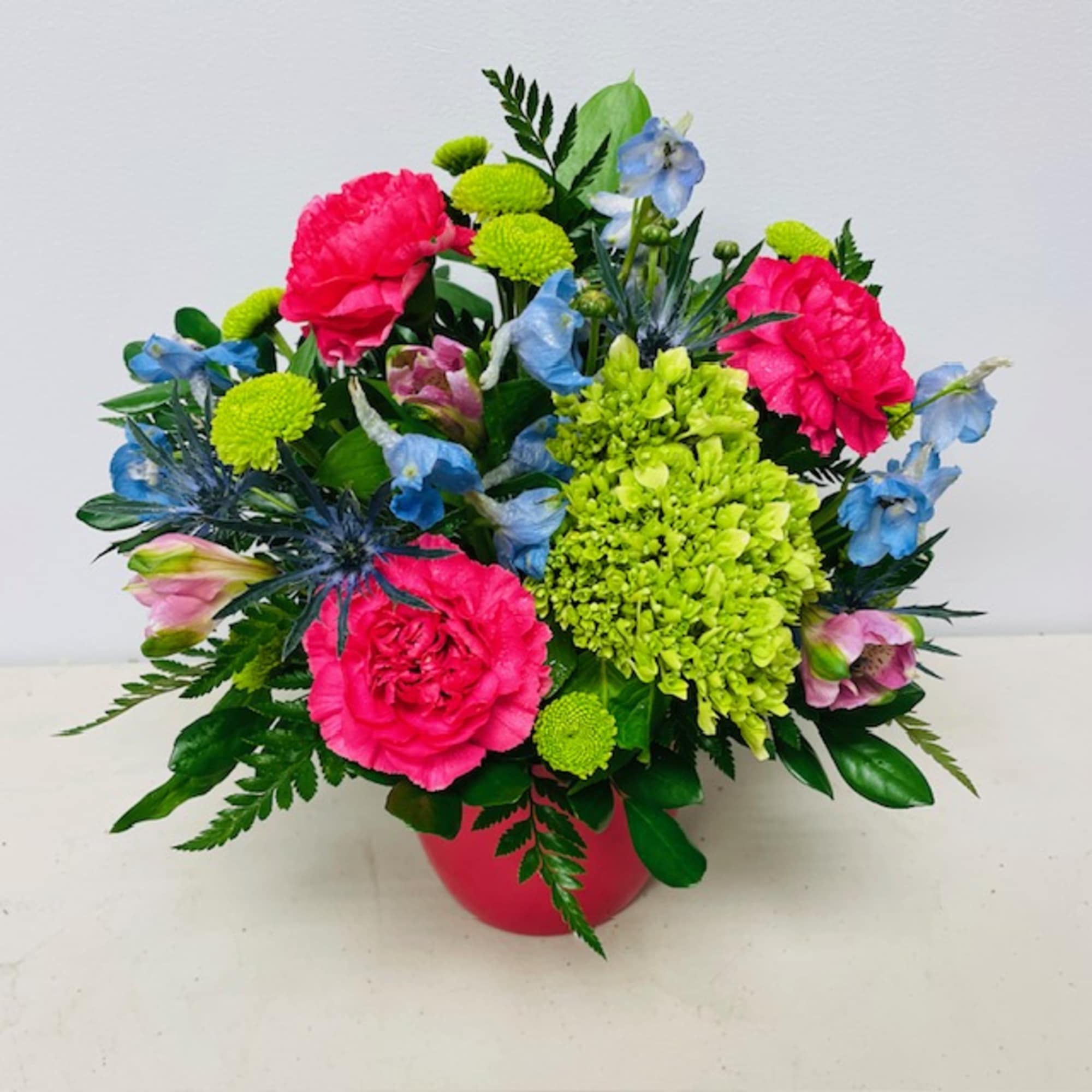 A selection of bright and cheerful flowers arranged in a vase or