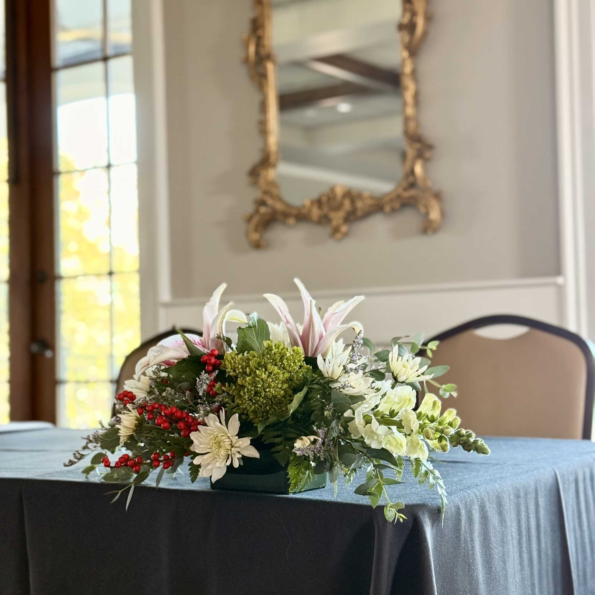 Beautiful holiday centerpiece in red, white, pink, and green.
Featuring:
- Stargazer Lilies
- Green