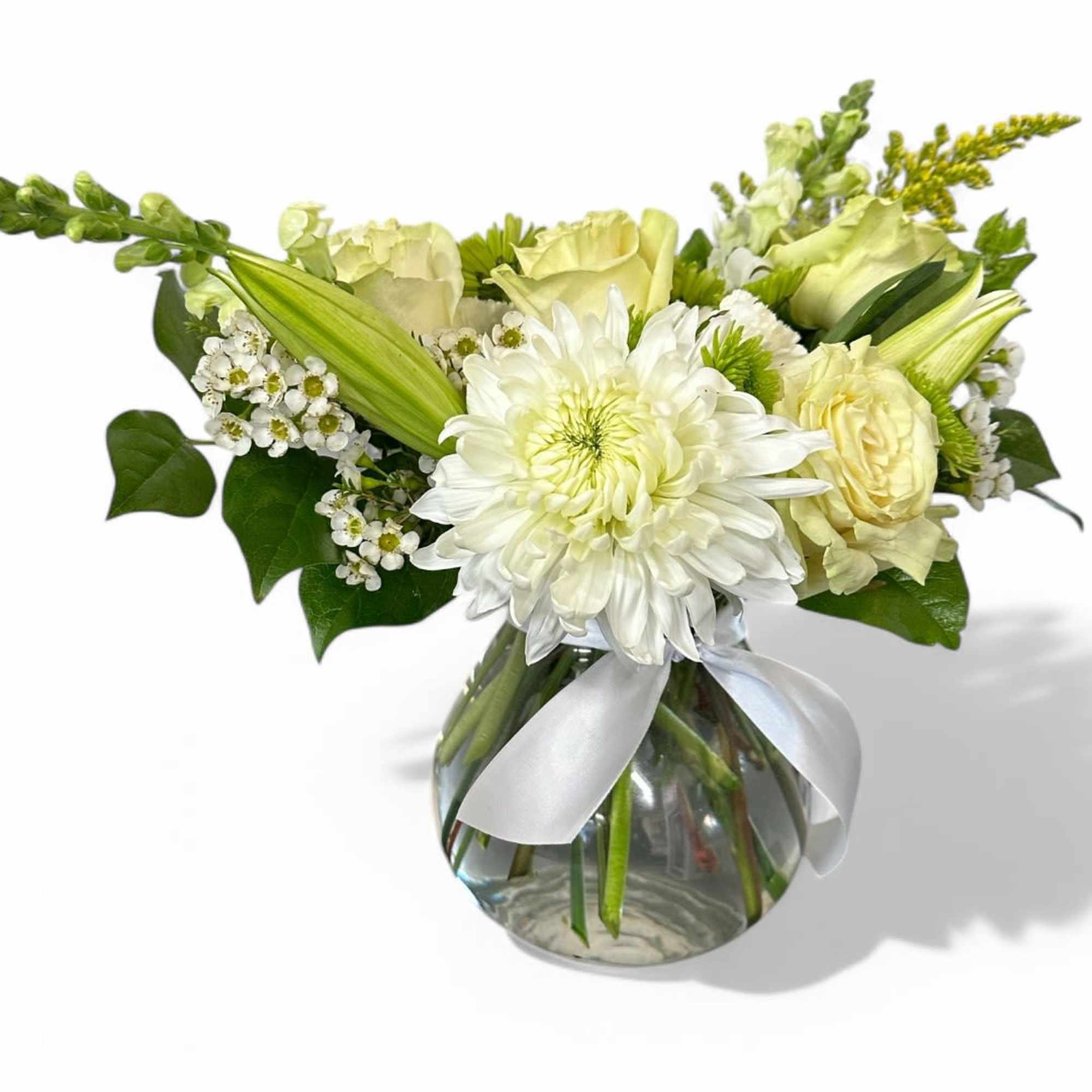 This stunning vase arrangement features an enchanting blend of white and green