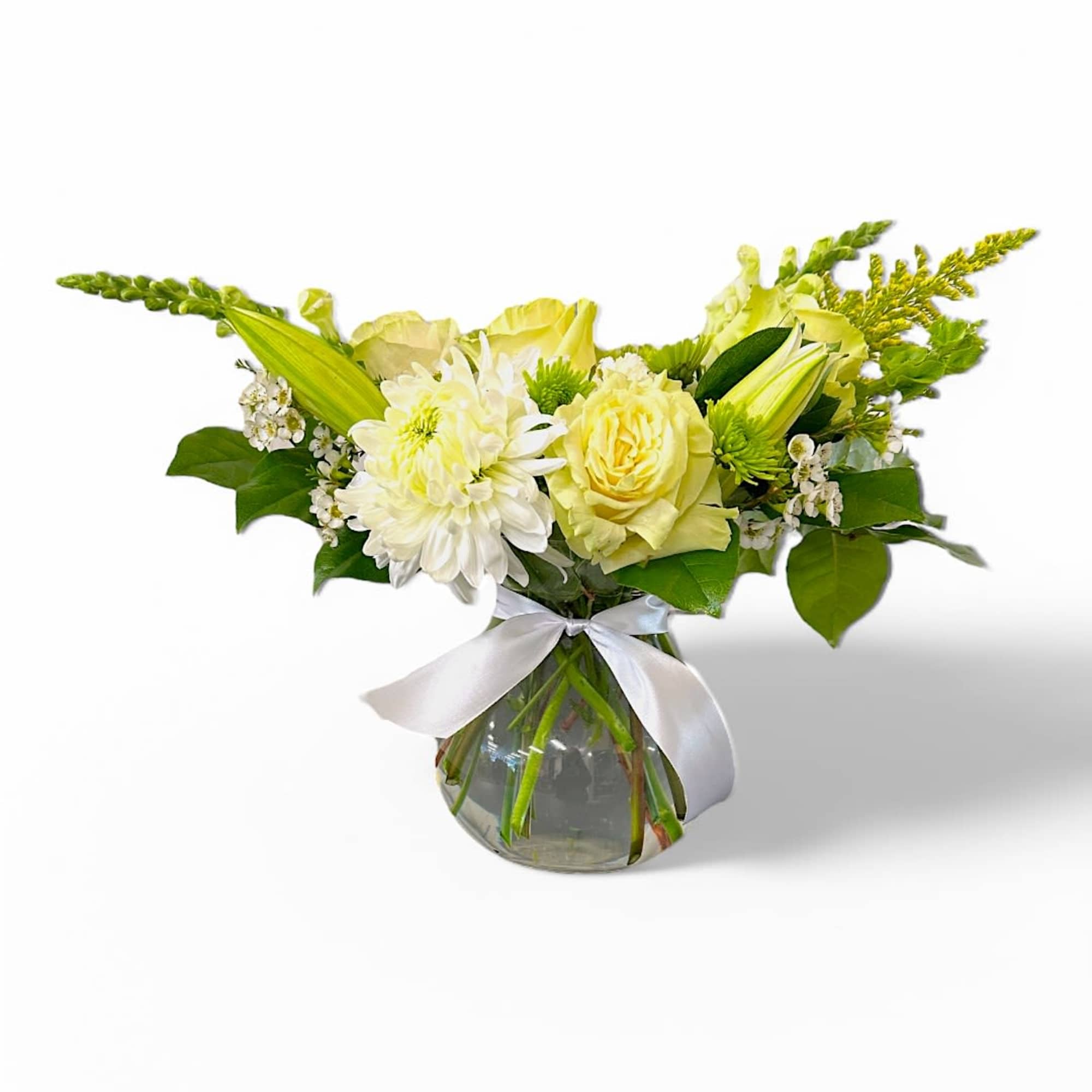 This stunning vase arrangement features an enchanting blend of white and green