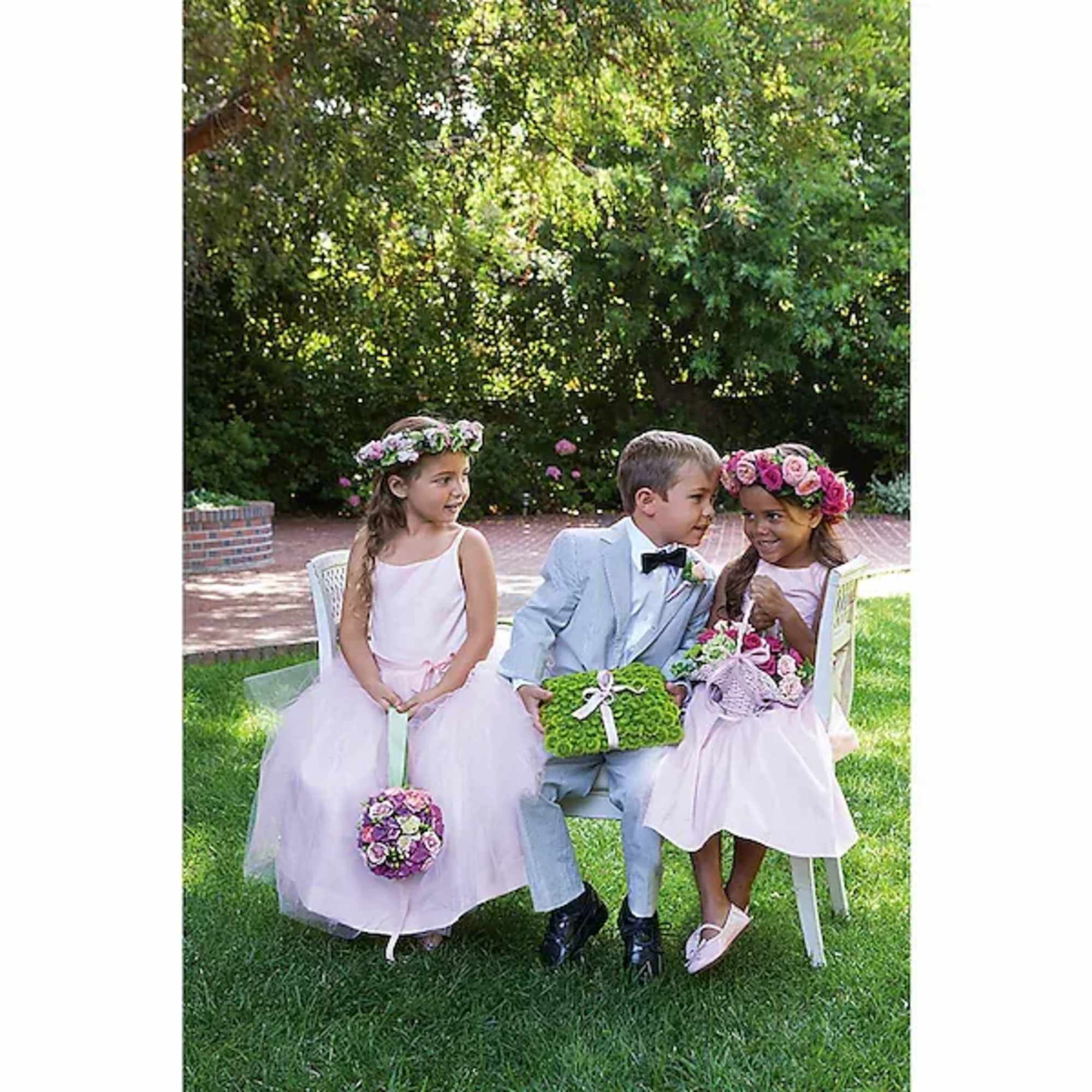 This perfect little basket of pink blooms and fresh greens is trimmed
