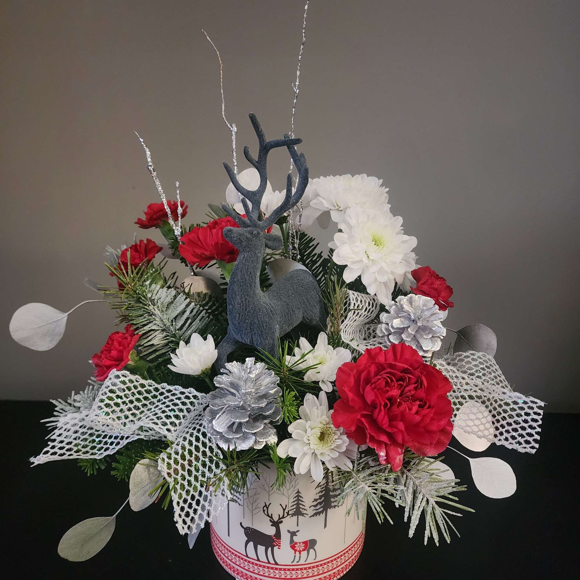 Holiday Deer Arrangement &ndash; Festive Christmas Floral Design
by The Magic Garden Florist

Celebrate