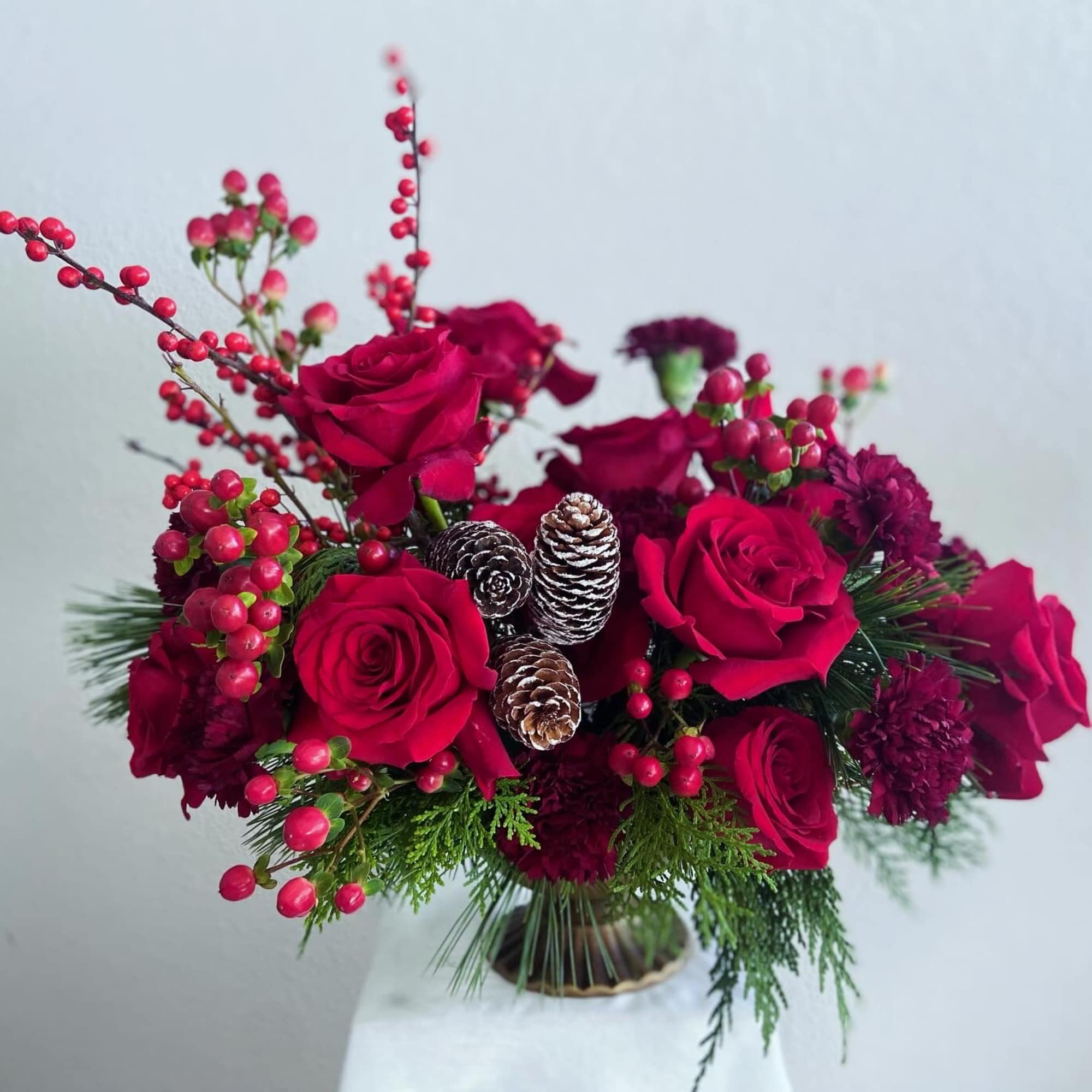 The &ldquo;Scarlet Yuletide&rdquo; is an April May Flowers original design. This captivating