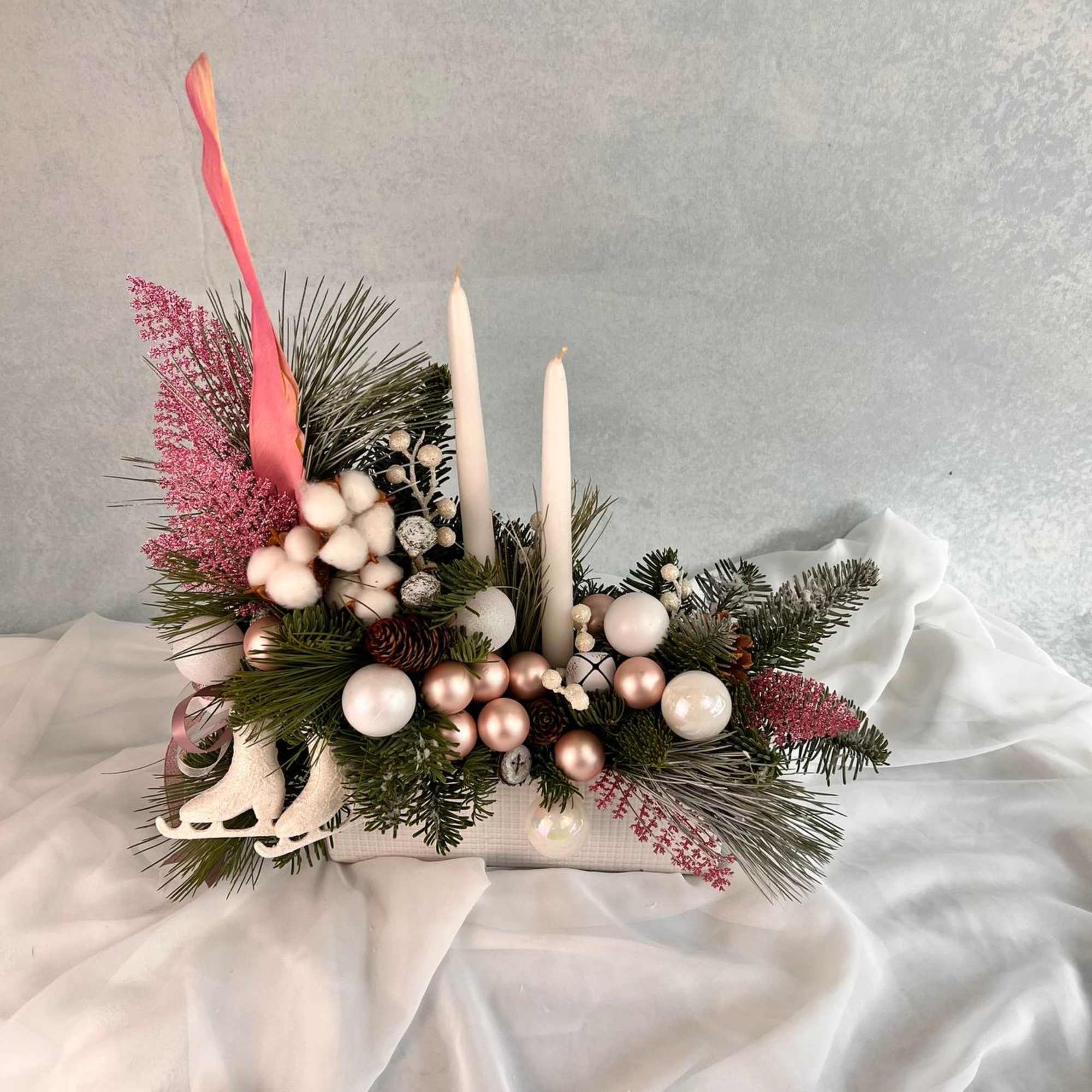 Christmas arrangement with candles is the perfect Christmas gift.
