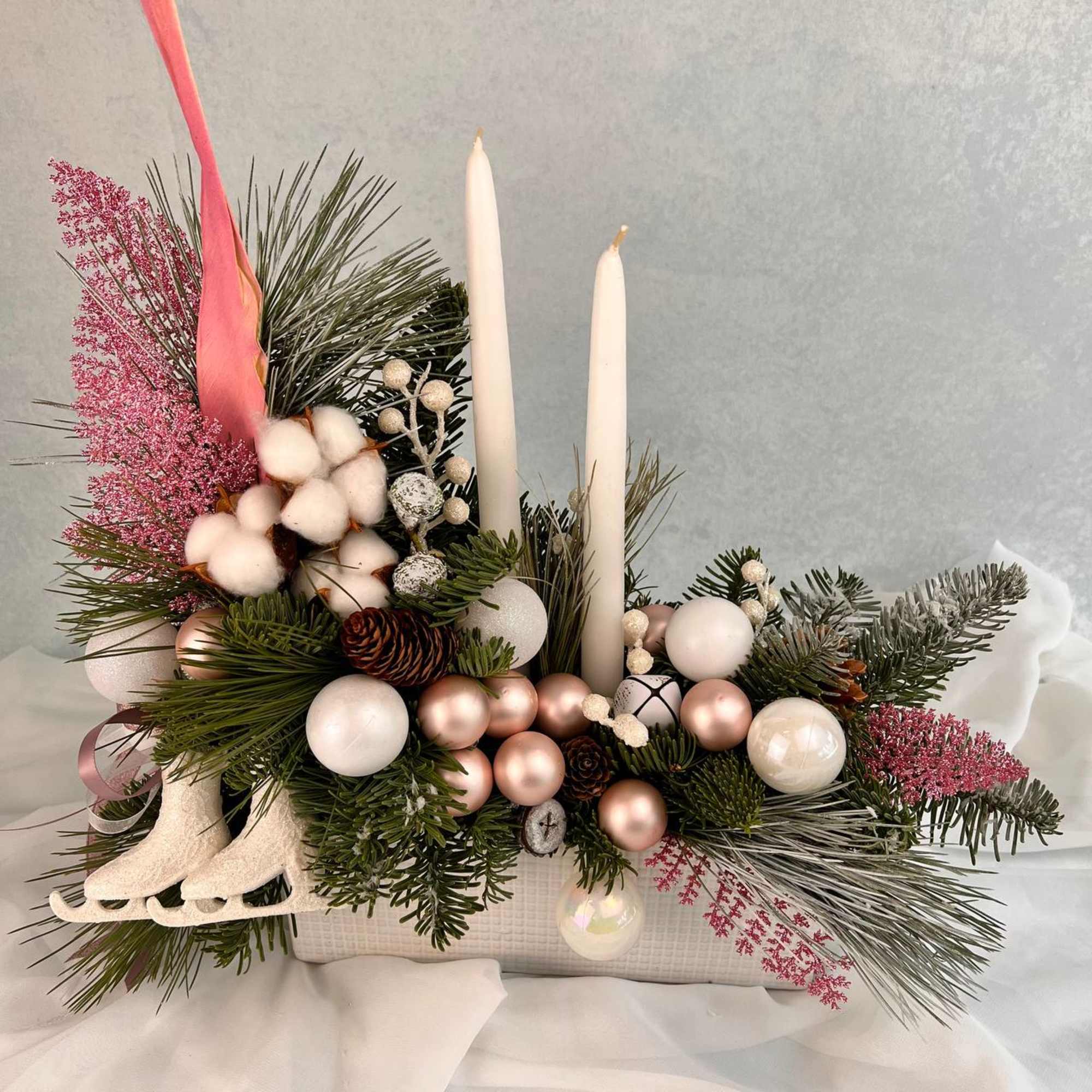 Christmas arrangement with candles is the perfect Christmas gift.
