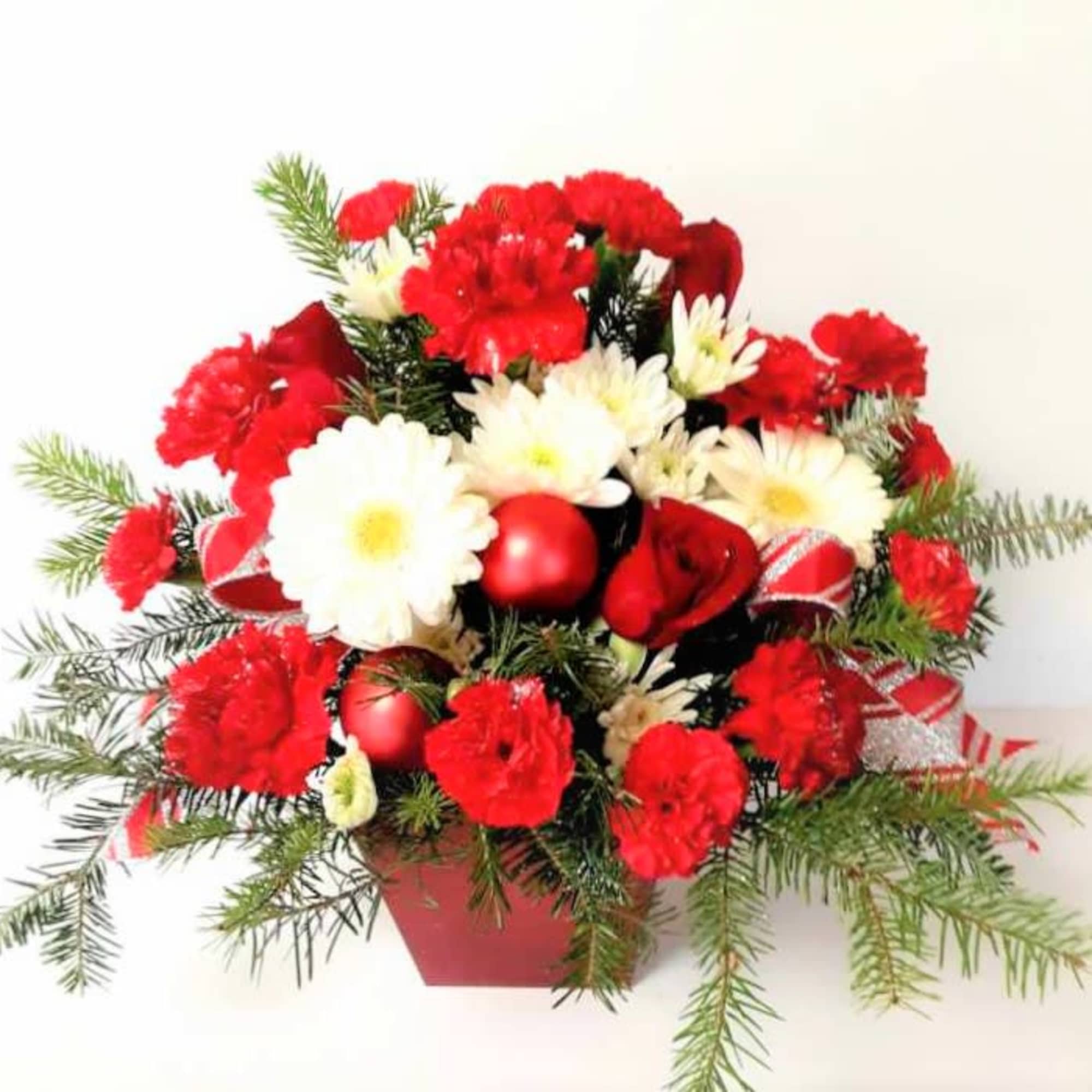 Just the right gift for a happy Christmas wish with carnations,mums,ribbon and