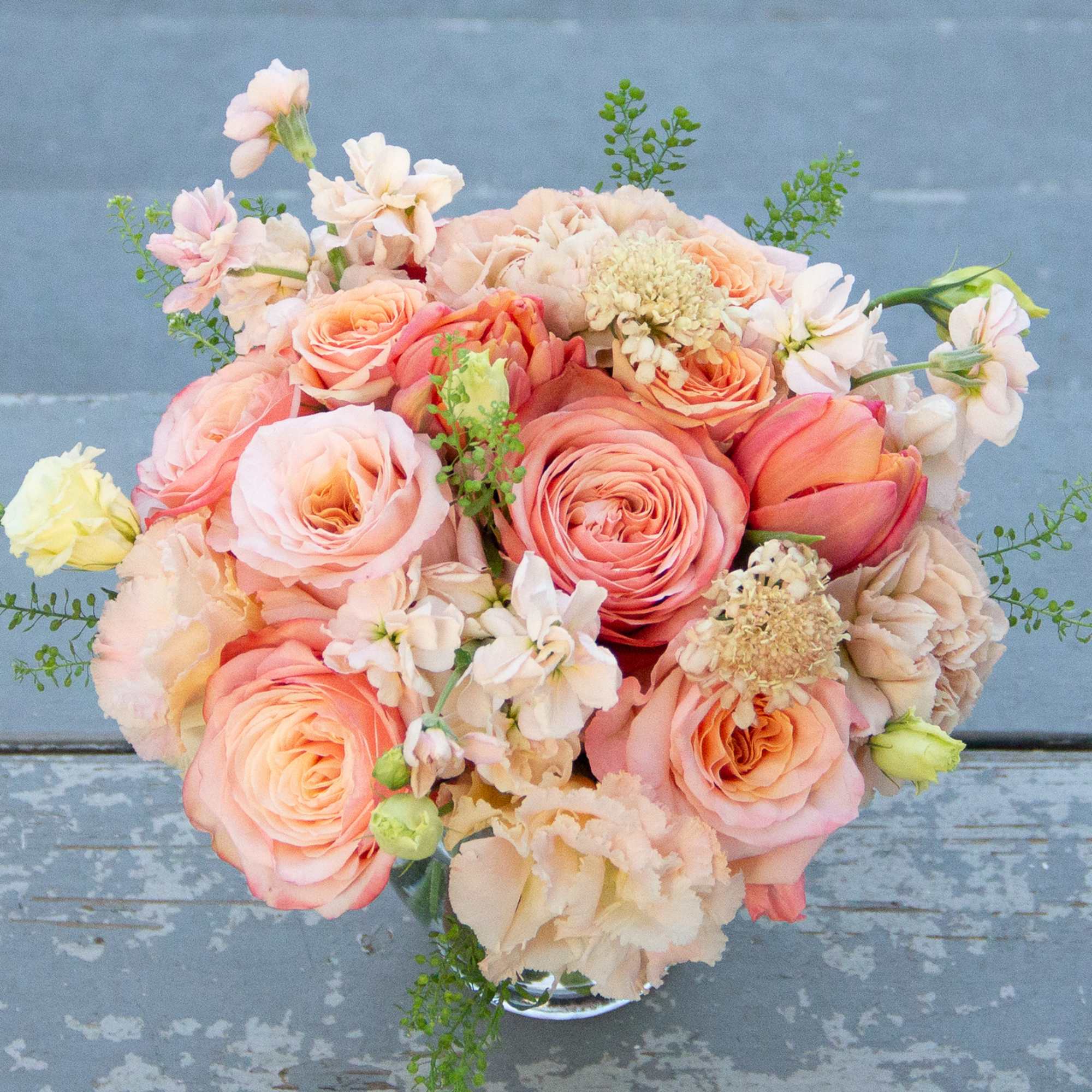 A lovely peach arrangement with a monochromatic peachy pink color scheme. This