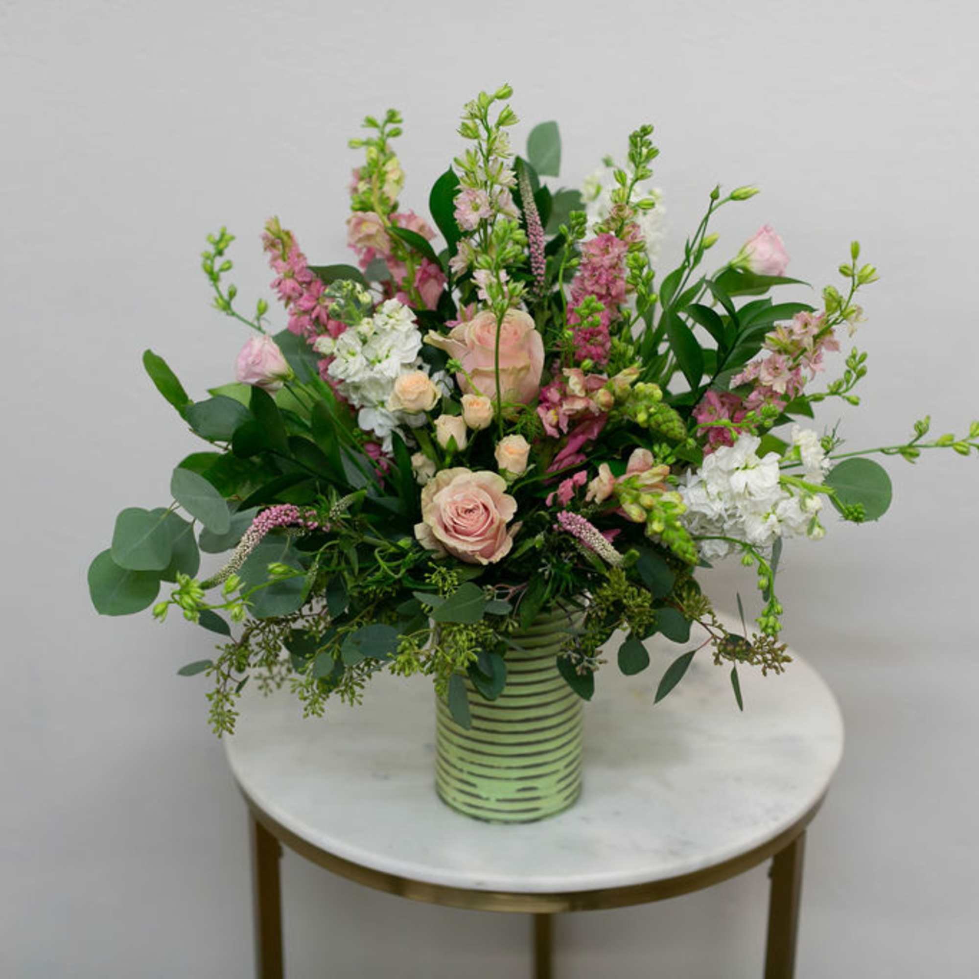 Vintage style floral arrangement in a wooden box.
(frontal facing arrangement)