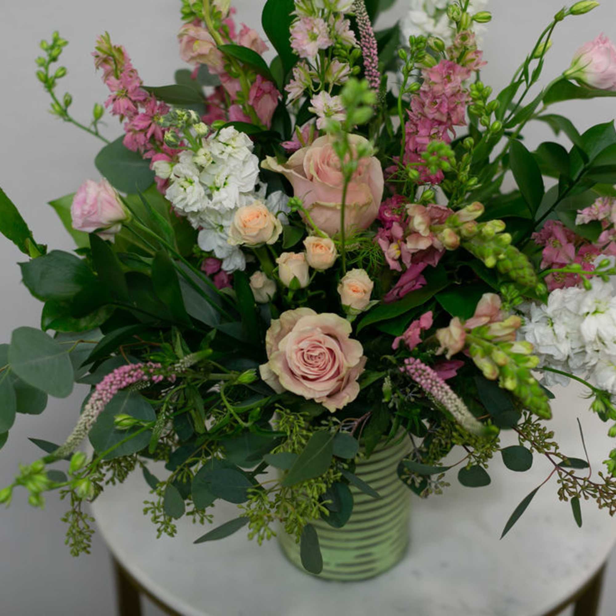 Vintage style floral arrangement in a wooden box.
(frontal facing arrangement)